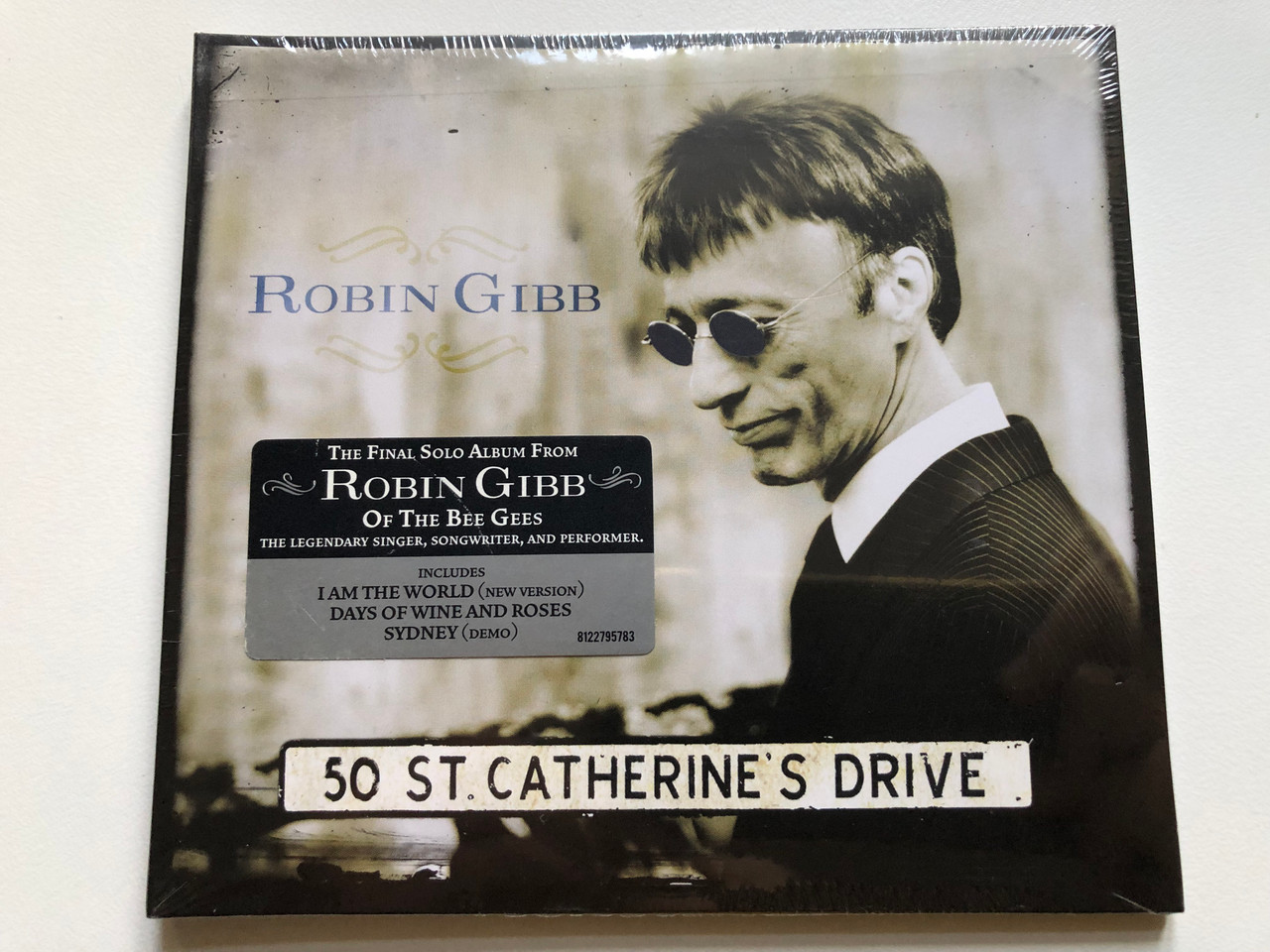 https://cdn10.bigcommerce.com/s-62bdpkt7pb/products/0/images/256234/Robin_Gibb_50_St._Catherines_Drive_The_Final_Solo_Album_From_Robin_Gibb_Of_The_Bee_Gees_-_The_Legendary_Singer_Songwriter_and_Performer_Reprise_Records_Audio_CD_2014_8122-79578-3_1__02926.1665662391.1280.1280.JPG?c=2&_gl=1*cstn4y*_ga*MjA2NTIxMjE2MC4xNTkwNTEyNTMy*_ga_WS2VZYPC6G*MTY2NTY0ODE2NC41OTEuMS4xNjY1NjYyMTY2LjQzLjAuMA..
