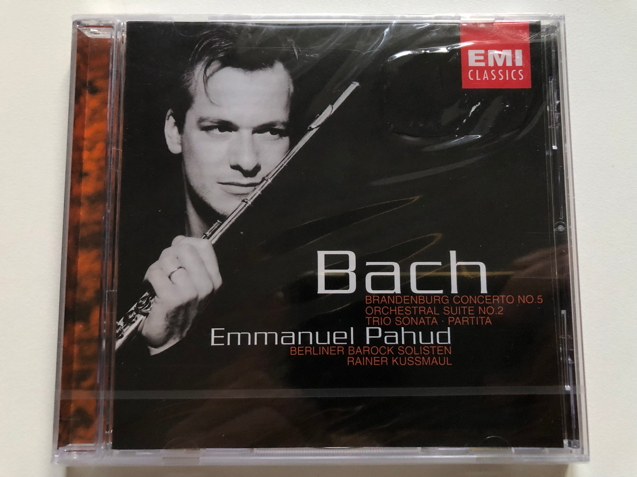 https://cdn10.bigcommerce.com/s-62bdpkt7pb/products/0/images/256286/Bach_-_Brandenburg_Concerto_No._5_Orchestral_Suite_No._2_Trio_Sonata_Partita_-_Emmanuel_Pahud_Berlin_Baroque_Soloists_Rainer_Kussmaul_EMI_Classics_Audio_CD_2001_724355711120_1__86695.1665740521.1280.1280.JPG?c=2&_gl=1*wlbkxd*_ga*MjA2NTIxMjE2MC4xNTkwNTEyNTMy*_ga_WS2VZYPC6G*MTY2NTczMTAxNC41OTIuMS4xNjY1NzQwNTE5LjYwLjAuMA..