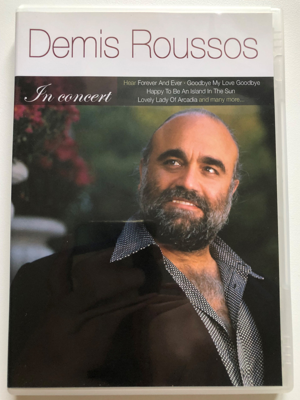 https://cdn10.bigcommerce.com/s-62bdpkt7pb/products/0/images/256762/Demis_Roussos_-_In_Concert_Hear_Forever_And_Ever_Goodbye_My_Love_Goodbye_Happy_To_Be_An_Island_In_The_Sun_Lovely_Lady_Of_Arcadia_and_many_more..._Elap_DVD_Video_CD_1991_80260716_1__56094.1666332413.1280.1280.JPG?c=2&_gl=1*3fbfgw*_ga*MjA2NTIxMjE2MC4xNTkwNTEyNTMy*_ga_WS2VZYPC6G*MTY2NjMzMTAzOS42MDEuMS4xNjY2MzMyMzczLjYwLjAuMA..