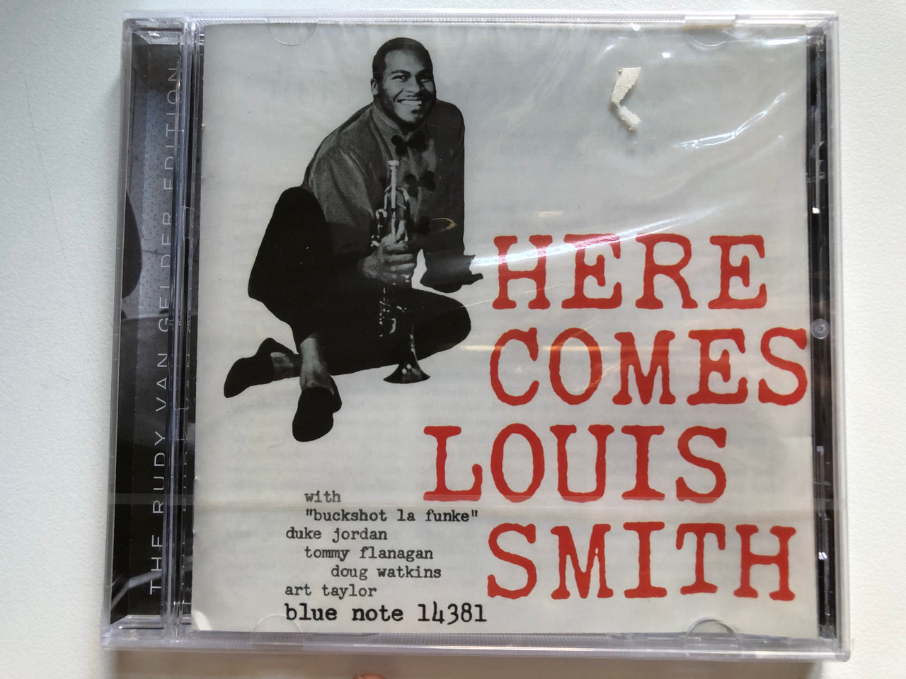 https://cdn10.bigcommerce.com/s-62bdpkt7pb/products/0/images/256808/Here_Comes_Louis_Smith_With_Buckshot_La_Funke_Duke_Jordan_Tommy_Flanagan_Doug_Watkins_Art_Taylor_Blue_Note_14381_Blue_Note_Audio_CD_2008_50999_5_14381_2_8_1__34633.1666342353.1280.1280.JPG?c=2&_gl=1*1gsfmo2*_ga*MjA2NTIxMjE2MC4xNTkwNTEyNTMy*_ga_WS2VZYPC6G*MTY2NjMzMTAzOS42MDEuMS4xNjY2MzQyMTcyLjQ3LjAuMA..