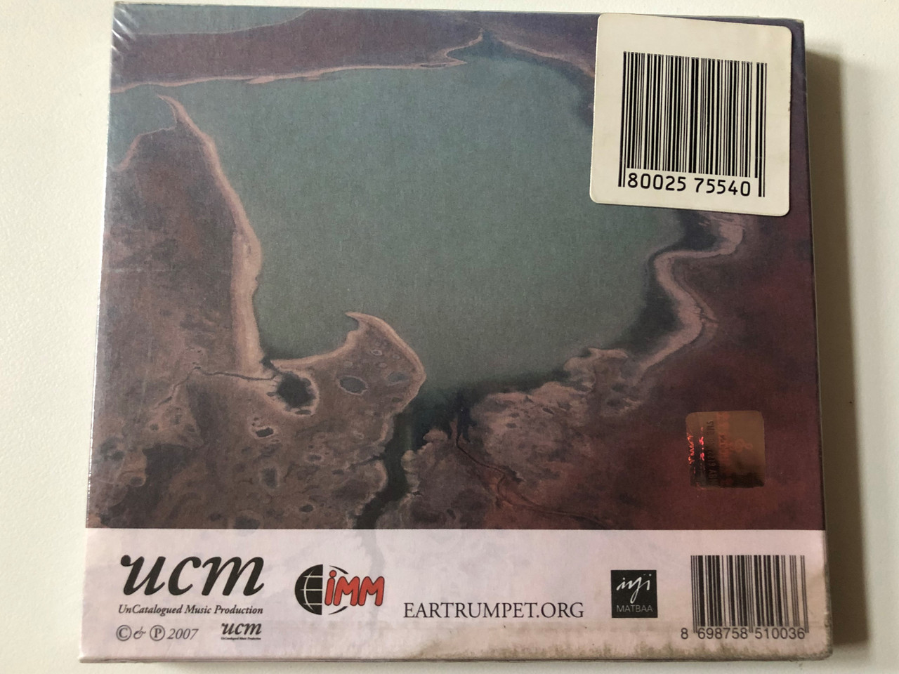 https://cdn10.bigcommerce.com/s-62bdpkt7pb/products/0/images/257056/Roger_Mills_Antipodesia_UnCatalogued_Music_Production_Audio_CD_2007_UCM003_2__55712.1666876427.1280.1280.JPG?c=2&_gl=1*6kd1a0*_ga*MjA2NTIxMjE2MC4xNTkwNTEyNTMy*_ga_WS2VZYPC6G*MTY2Njg3MzQxMS42MDUuMS4xNjY2ODc2MjU5LjMzLjAuMA..