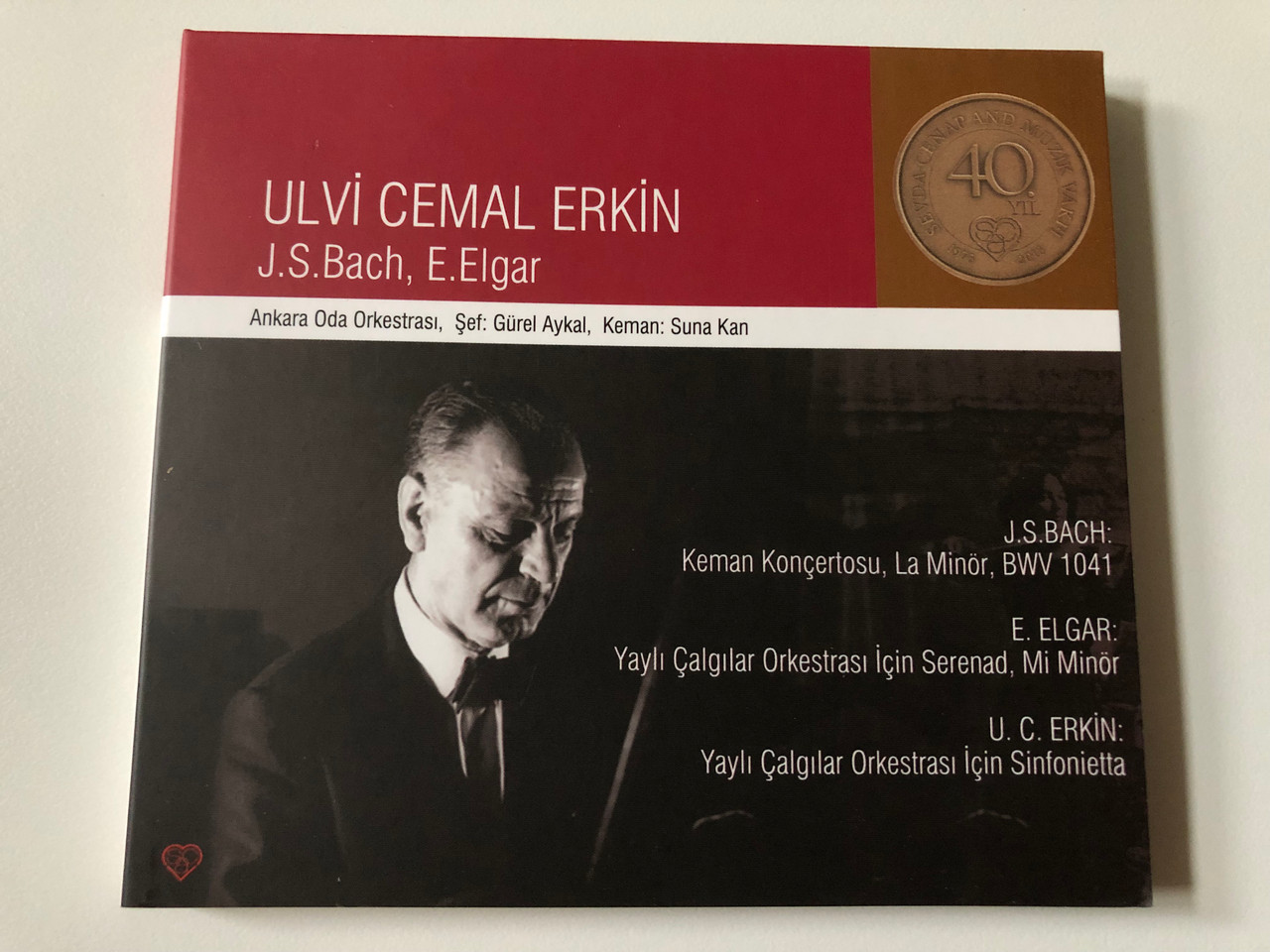 https://cdn10.bigcommerce.com/s-62bdpkt7pb/products/0/images/257073/Ulvi_Cemal_Erkin_J._S._Bach_E_Elgar_-_Ankara_Oda_Orchestrasi_Sef_Grer_Aykal_Kerman_Suna_Kan_J._S._Bach_Keman_Koncertosu_La_Minor_BWV_1041_E._Elgar_Yayli_Calgilar_Orkestasi_Icin_Seren_1__54304.1666879022.1280.1280.JPG?c=2&_gl=1*1bkxt5d*_ga*MjA2NTIxMjE2MC4xNTkwNTEyNTMy*_ga_WS2VZYPC6G*MTY2Njg3MzQxMS42MDUuMS4xNjY2ODc5MTA1LjYwLjAuMA..