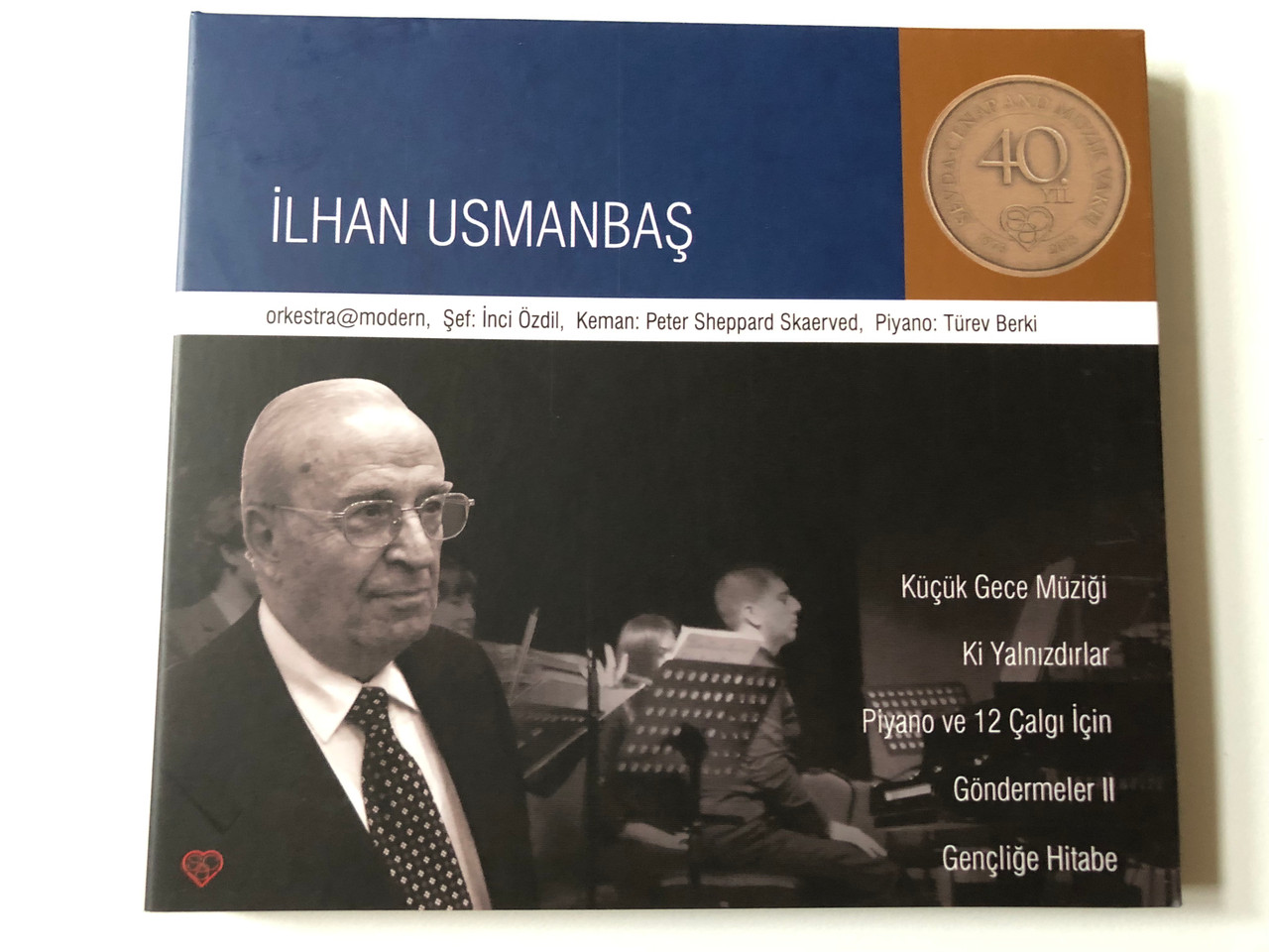 https://cdn10.bigcommerce.com/s-62bdpkt7pb/products/0/images/257086/Ilhan_Usmanbas_-_orkestramodern_Sef_Inci_Ozdil_Keman_Peter_Sheppard_Skaerved_Piyano_Turev_Berki_Kucuk_Gece_Muzigi_Ki_Yalnizdirlar_Piyano_ve_12_Calgi_Icin_Gondermeler_II_SCA_Music_Fou_1__02183.1666879645.1280.1280.JPG?c=2&_gl=1*1ic8gut*_ga*MjA2NTIxMjE2MC4xNTkwNTEyNTMy*_ga_WS2VZYPC6G*MTY2Njg3MzQxMS42MDUuMS4xNjY2ODc5NjE2LjYwLjAuMA..