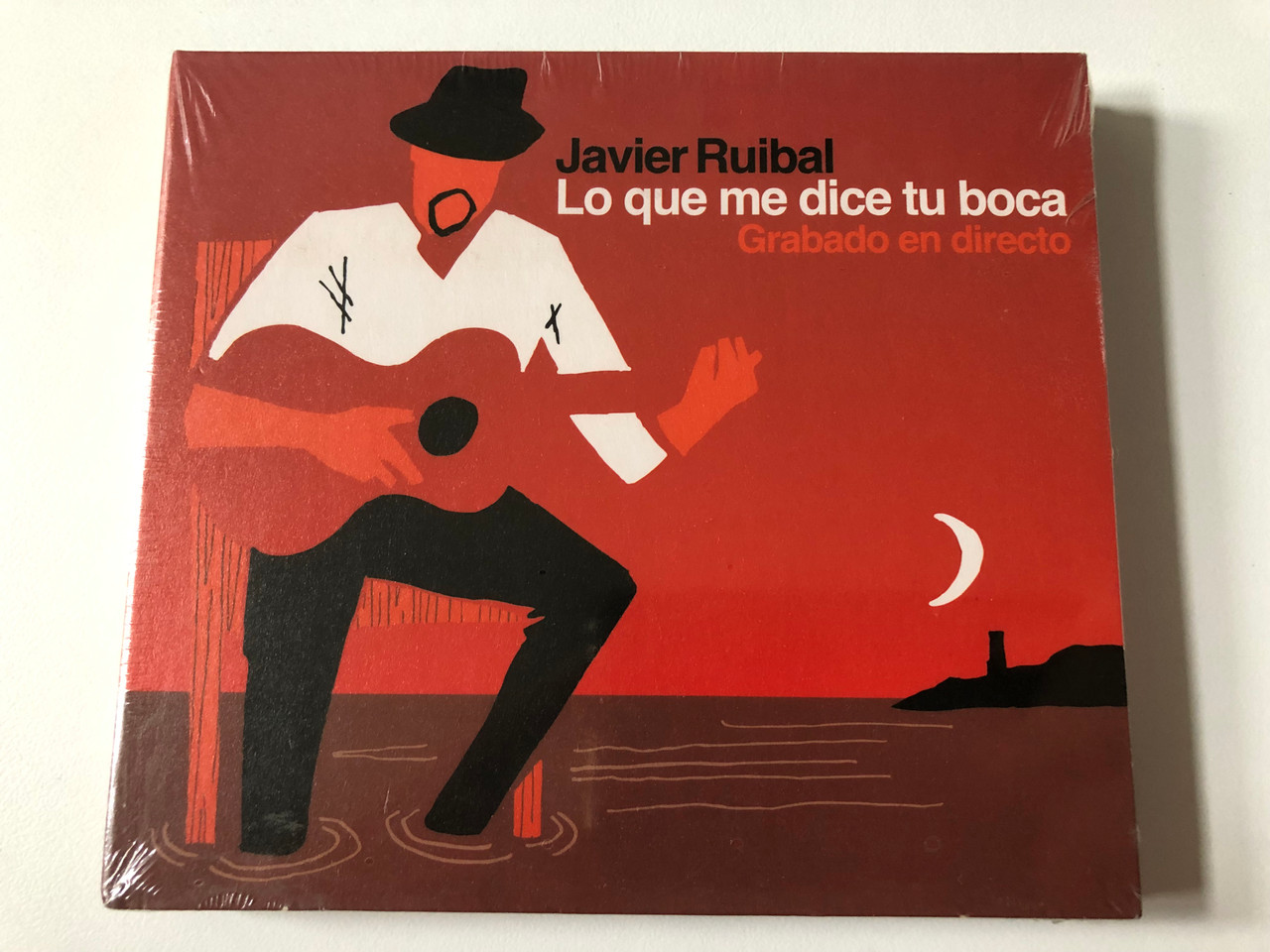 https://cdn10.bigcommerce.com/s-62bdpkt7pb/products/0/images/257110/Javier_Ruibal_Lo_Que_Me_Dice_Tu_Boca_Grabado_En_Directo_18_Chulos_Records_Audio_CD_2005_91123_1__45094.1666884729.1280.1280.JPG?c=2&_gl=1*w6j12h*_ga*MjA2NTIxMjE2MC4xNTkwNTEyNTMy*_ga_WS2VZYPC6G*MTY2Njg3MzQxMS42MDUuMS4xNjY2ODg0NjA1LjQ5LjAuMA..