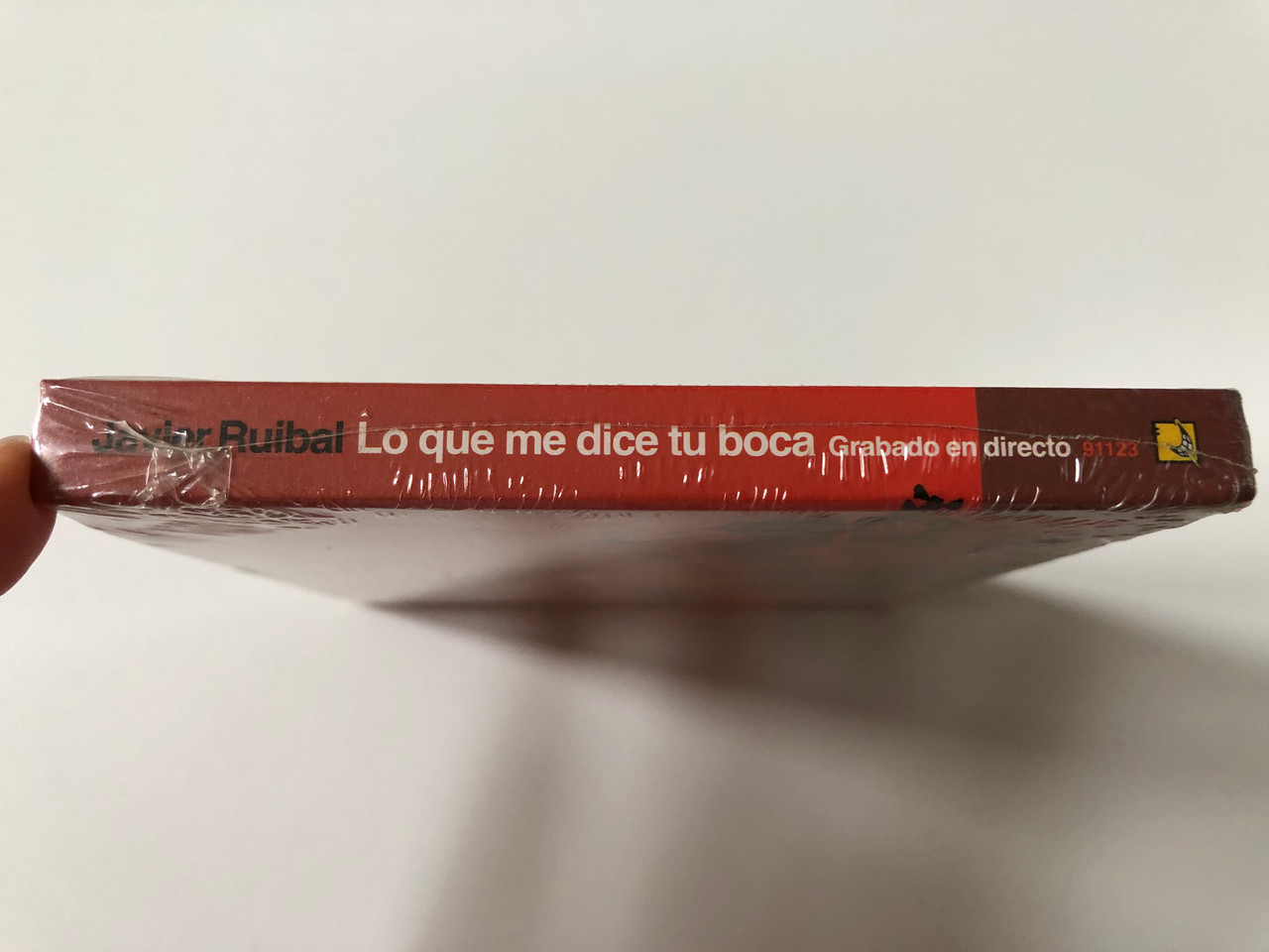 https://cdn10.bigcommerce.com/s-62bdpkt7pb/products/0/images/257112/Javier_Ruibal_Lo_Que_Me_Dice_Tu_Boca_Grabado_En_Directo_18_Chulos_Records_Audio_CD_2005_91123_3__76767.1666884744.1280.1280.JPG?c=2&_gl=1*w6j12h*_ga*MjA2NTIxMjE2MC4xNTkwNTEyNTMy*_ga_WS2VZYPC6G*MTY2Njg3MzQxMS42MDUuMS4xNjY2ODg0NjA1LjQ5LjAuMA..