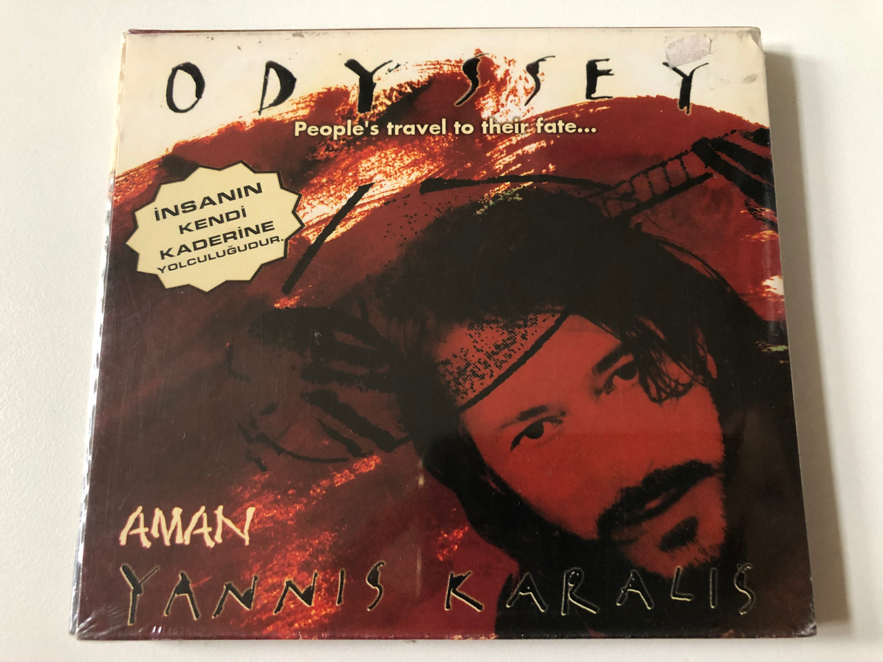 https://cdn10.bigcommerce.com/s-62bdpkt7pb/products/0/images/257208/Yannis_Karalis_Odyssey_Peoples_travel_to_their_fate..._Insanin_Kendi_Kaderine_Yolculugudur._FM_Records_Audio_CD_2009_FM_372_1__26721.1666975135.1280.1280.JPG?c=2&_gl=1*oe6ocq*_ga*MjA2NTIxMjE2MC4xNTkwNTEyNTMy*_ga_WS2VZYPC6G*MTY2Njk2MjE1OC42MDcuMS4xNjY2OTc0OTg5LjQzLjAuMA..