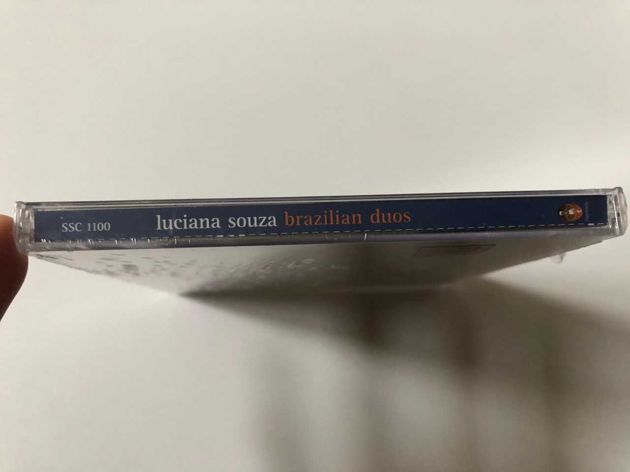 https://cdn10.bigcommerce.com/s-62bdpkt7pb/products/0/images/257407/Luciana_Souza_Brazilian_Duos_Sunnyside_Audio_CD_2002_SSC_1100_3__56184.1667292790.1280.1280.JPG?c=2&_gl=1*tqrw1y*_ga*MjA2NTIxMjE2MC4xNTkwNTEyNTMy*_ga_WS2VZYPC6G*MTY2NzI4NTYzMC42MTEuMS4xNjY3MjkyNjU2LjM4LjAuMA..