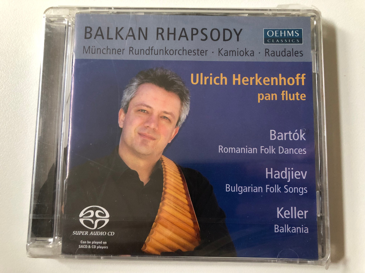 https://cdn10.bigcommerce.com/s-62bdpkt7pb/products/0/images/257532/Balkan_Rhapsody_-_Mnchner_Rundfunkorchester_Kamioka_Raudales_-_Ulrich_Herkenhoff_pan_flute_Bartok_-_Romanian_Folk_Dances_Hadjiev_-_Bulgarian_Folk_Songs_Keller_-_Balkania_Oehms_Classics_1__40353.1667379846.1280.1280.JPG?c=2&_gl=1*12ug567*_ga*MjA2NTIxMjE2MC4xNTkwNTEyNTMy*_ga_WS2VZYPC6G*MTY2NzM3MTQ0OS42MTMuMS4xNjY3Mzc5Njc3LjUwLjAuMA..