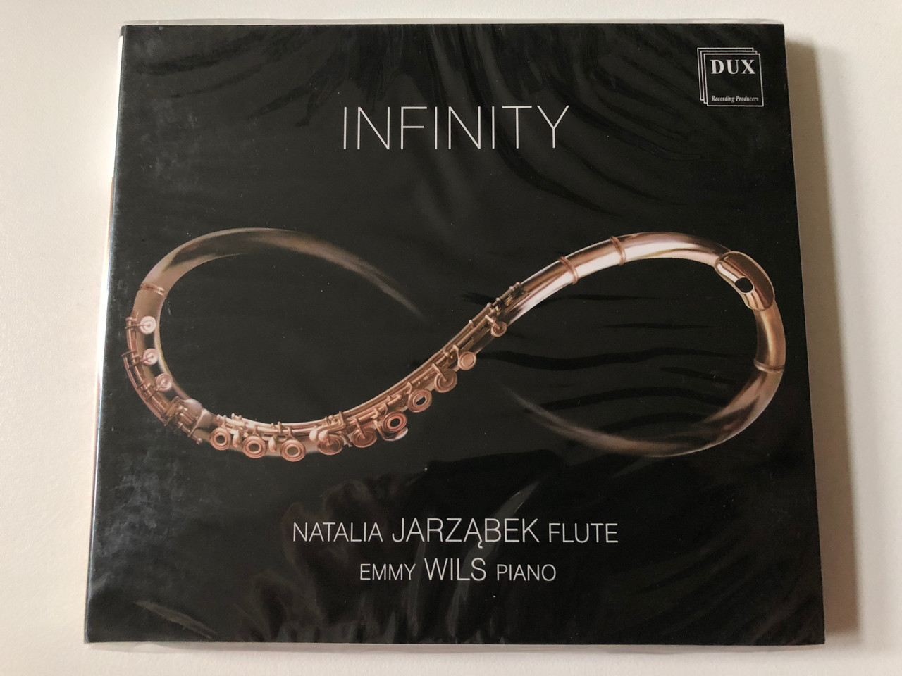 https://cdn10.bigcommerce.com/s-62bdpkt7pb/products/0/images/257600/Infinity_-_Natalia_Jarzbek_flute_Emmy_Wils_piano_DUX_Recording_Producers_Audio_CD_2019_DUX_1457_1__75880.1667463457.1280.1280.JPG?c=2&_gl=1*1mgpmhp*_ga*MjA2NTIxMjE2MC4xNTkwNTEyNTMy*_ga_WS2VZYPC6G*MTY2NzQ1OTcxNy42MTUuMS4xNjY3NDYzNDcyLjYwLjAuMA..