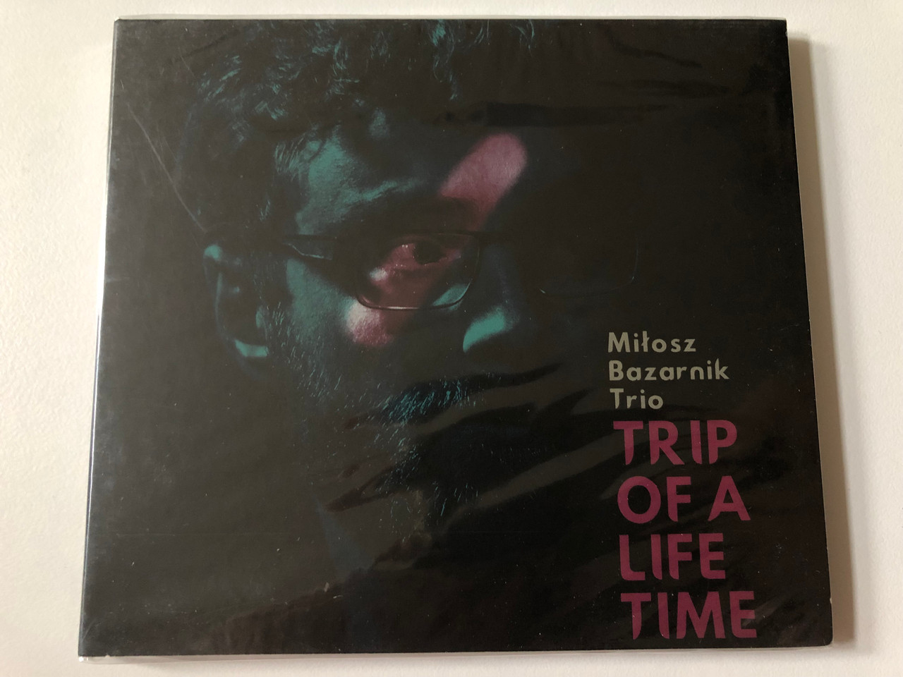 https://cdn10.bigcommerce.com/s-62bdpkt7pb/products/0/images/257648/Milosz_Bazarnik_Trio_-_Trip_Of_A_Life_Time_DUX_Recording_Producers_Audio_CD_2018_DUX_1493_1__77548.1667471428.1280.1280.JPG?c=2&_gl=1*swwhzl*_ga*MjA2NTIxMjE2MC4xNTkwNTEyNTMy*_ga_WS2VZYPC6G*MTY2NzQ1OTcxNy42MTUuMS4xNjY3NDcxMjgyLjYwLjAuMA..