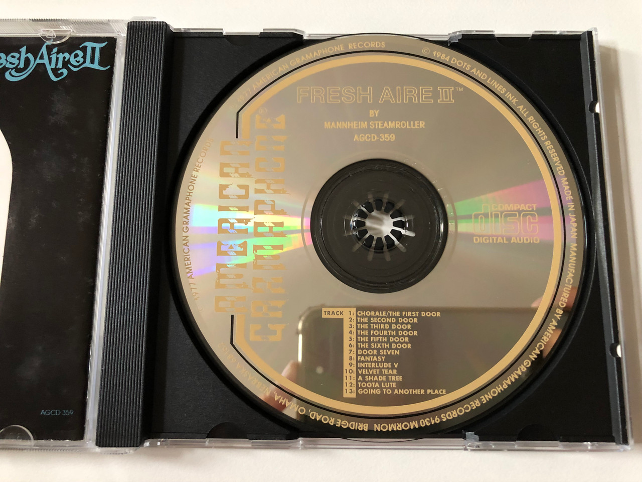 https://cdn10.bigcommerce.com/s-62bdpkt7pb/products/0/images/257672/Fresh_Aire_II_-_By_Mannheim_Steamroller_American_Gramaphone_Records_Audio_CD_1984_AGCD_359_3__72857.1667474570.1280.1280.JPG?c=2&_gl=1*ad2bji*_ga*MjA2NTIxMjE2MC4xNTkwNTEyNTMy*_ga_WS2VZYPC6G*MTY2NzQ1OTcxNy42MTUuMS4xNjY3NDc0NTM4LjYwLjAuMA..