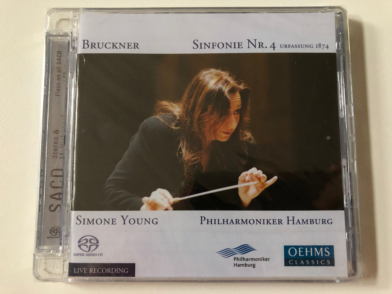 https://cdn10.bigcommerce.com/s-62bdpkt7pb/products/0/images/257742/Bruckner_-_Sinfonie_Nr._4_Urfassung_1874_-_Simone_Young_Philharmoniker_Hamburg_Oehms_Classics_Hybrid_Disc_2008_OC_629_1__19639.1667547488.1280.1280.JPG?c=2&_gl=1*1hp4q8o*_ga*MjA2NTIxMjE2MC4xNTkwNTEyNTMy*_ga_WS2VZYPC6G*MTY2NzU0NTYyOS42MTcuMS4xNjY3NTQ3NDU3LjEuMC4w