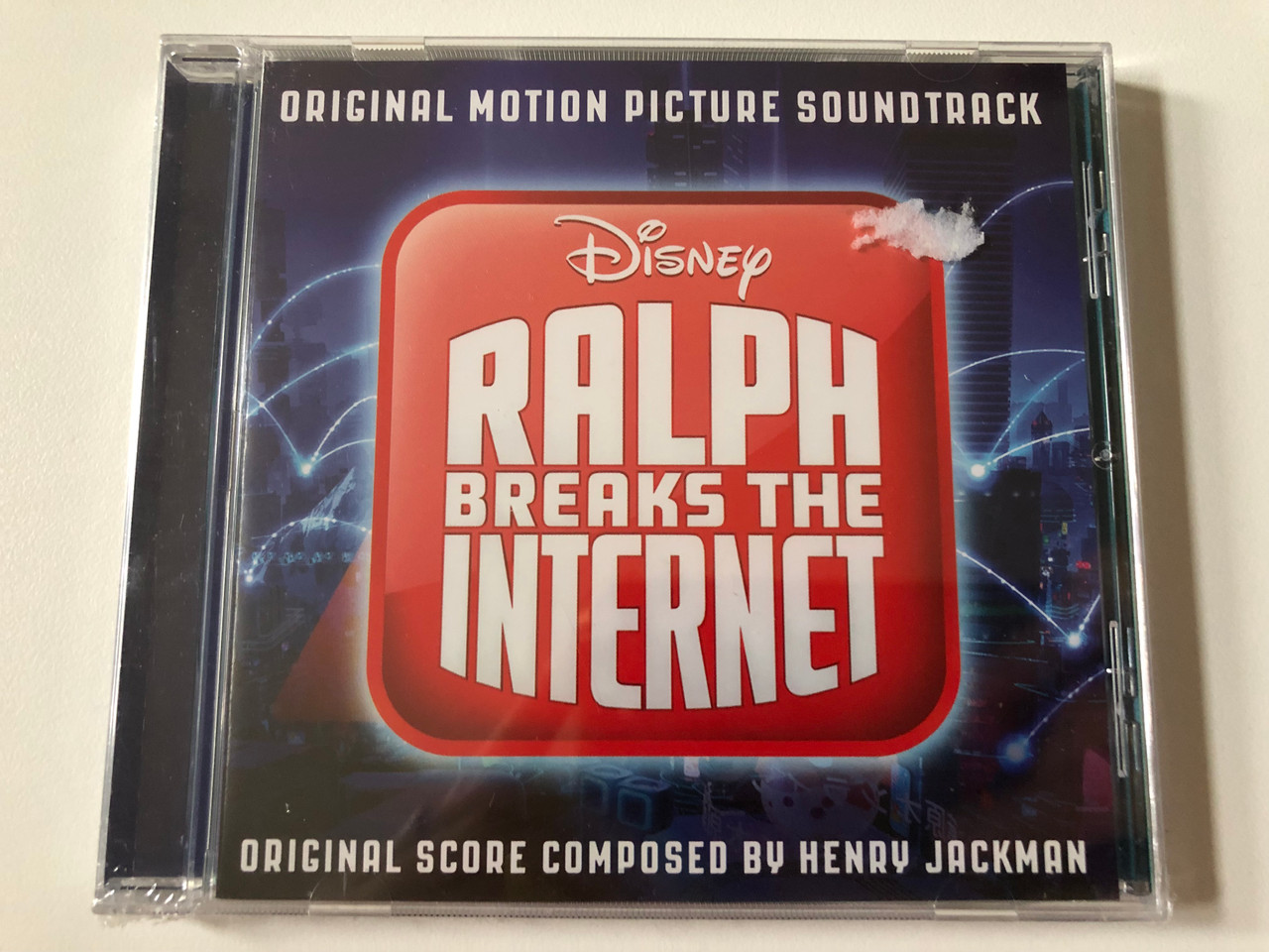 https://cdn10.bigcommerce.com/s-62bdpkt7pb/products/0/images/257751/Ralph_Breaks_The_Internet_Original_Motion_Picture_Soundtrack_-_Original_Score_Composed_By_Henry_Jackman_Walt_Disney_Records_Audio_CD_2018_00050087403966_1__35808.1667550005.1280.1280.JPG?c=2&_gl=1*1bh09w2*_ga*MjA2NTIxMjE2MC4xNTkwNTEyNTMy*_ga_WS2VZYPC6G*MTY2NzU0NTYyOS42MTcuMS4xNjY3NTUwMDA1LjYwLjAuMA..