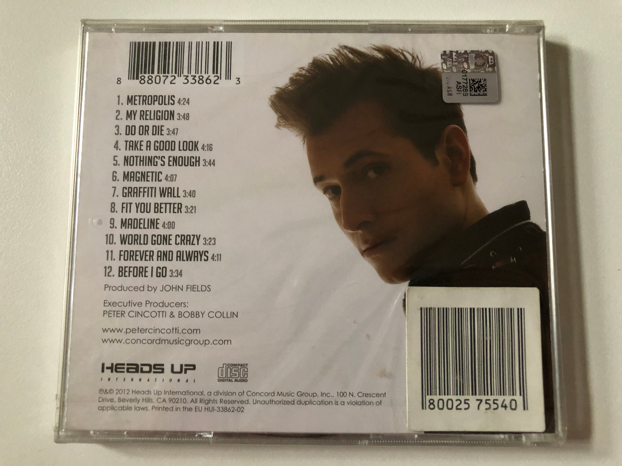 https://cdn10.bigcommerce.com/s-62bdpkt7pb/products/0/images/257758/Peter_Cincotti_Metropolis_Heads_Up_International_Audio_CD_2012_HUI-33862-02_2__63868.1667550790.1280.1280.JPG?c=2&_gl=1*8vrtie*_ga*MjA2NTIxMjE2MC4xNTkwNTEyNTMy*_ga_WS2VZYPC6G*MTY2NzU0NTYyOS42MTcuMS4xNjY3NTUwNjY4LjUxLjAuMA..