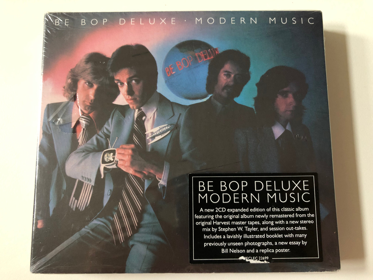 https://cdn10.bigcommerce.com/s-62bdpkt7pb/products/0/images/257765/Be_Bop_Deluxe_Modern_Music_A_new_CD_expanded_edition_of_this_classic_album_featuring_the_original_album_newly_remastered_from_the_original_Harvest_master_tapes_Esoteric_Recordings_2x_Audio_1__83265.1667551301.1280.1280.JPG?c=2&_gl=1*1aw9edo*_ga*MjA2NTIxMjE2MC4xNTkwNTEyNTMy*_ga_WS2VZYPC6G*MTY2NzU0NTYyOS42MTcuMS4xNjY3NTUxMjkzLjYwLjAuMA..