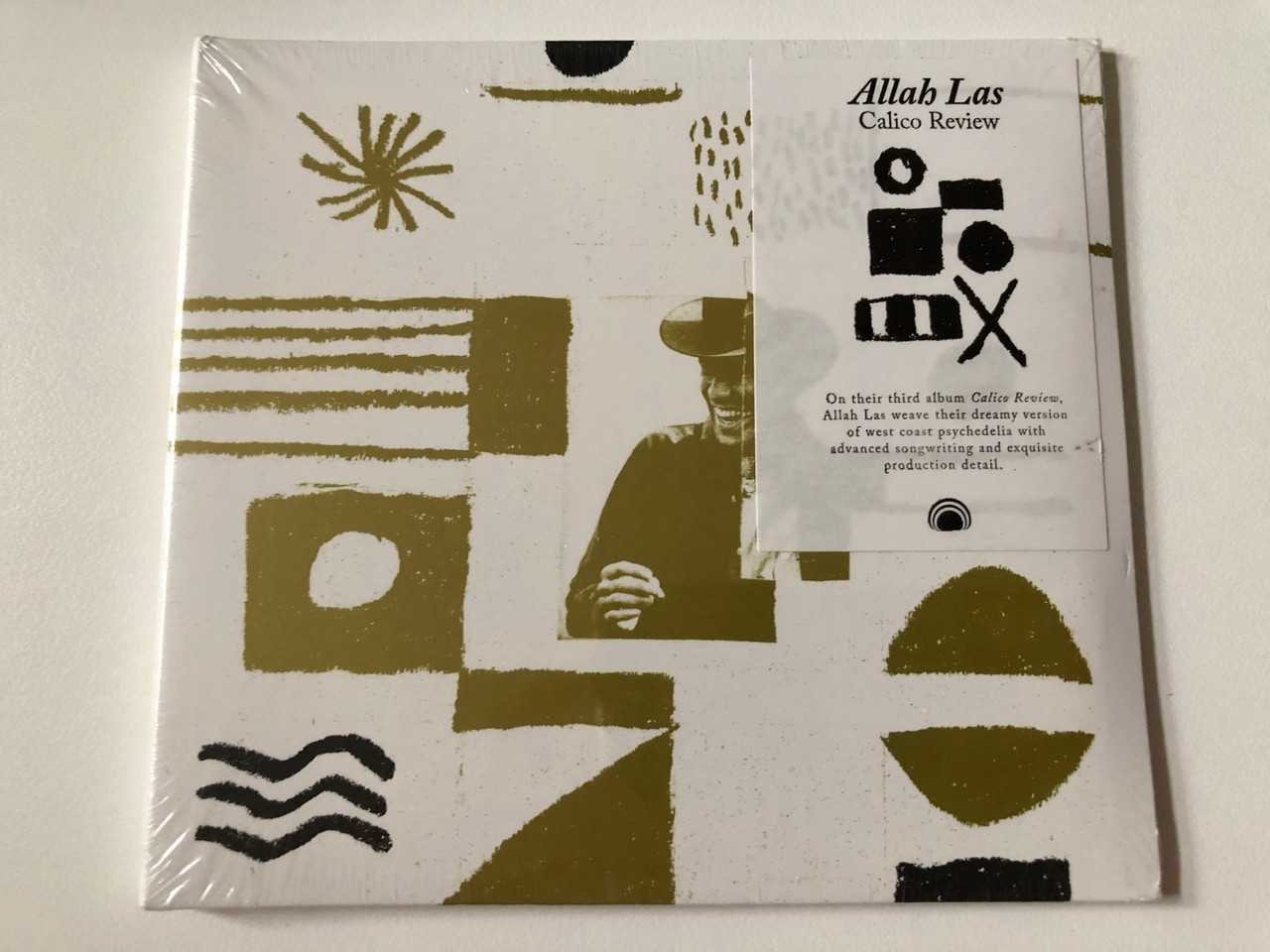 https://cdn10.bigcommerce.com/s-62bdpkt7pb/products/0/images/257774/Allah_Las_-_Calico_Review_On_their_third_album_Calico_Review_Allah_Las_weave_their_dreamy_version_of_west_coast_psychedelia_with_advanced_songwriting_and_exquisite_production_deatil._Mexica_1__27057.1667552427.1280.1280.JPG?c=2&_gl=1*10yolmv*_ga*MjA2NTIxMjE2MC4xNTkwNTEyNTMy*_ga_WS2VZYPC6G*MTY2NzU0NTYyOS42MTcuMS4xNjY3NTUyMTg5LjI5LjAuMA..