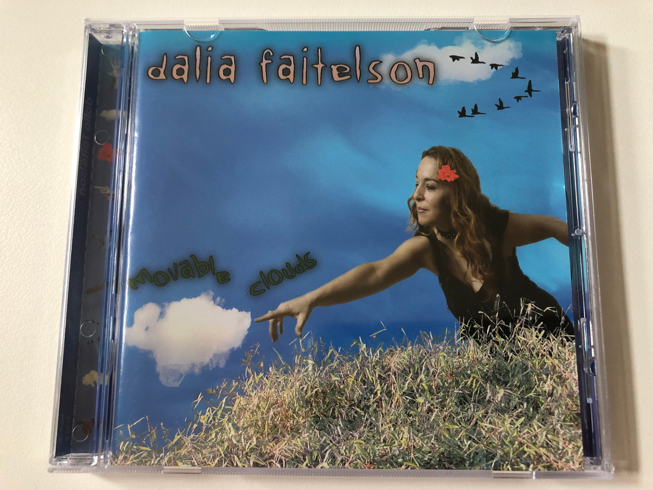 https://cdn10.bigcommerce.com/s-62bdpkt7pb/products/0/images/257913/Dalia_Faitelson_Movable_Clouds_Enja_Records_Audio_CD_2004_CD_9156-2_1__18878.1667835632.1280.1280.JPG?c=2&_gl=1*1286zfv*_ga*MjA2NTIxMjE2MC4xNTkwNTEyNTMy*_ga_WS2VZYPC6G*MTY2NzgzMzMyOS42MTkuMS4xNjY3ODM1NjQ3LjYwLjAuMA..