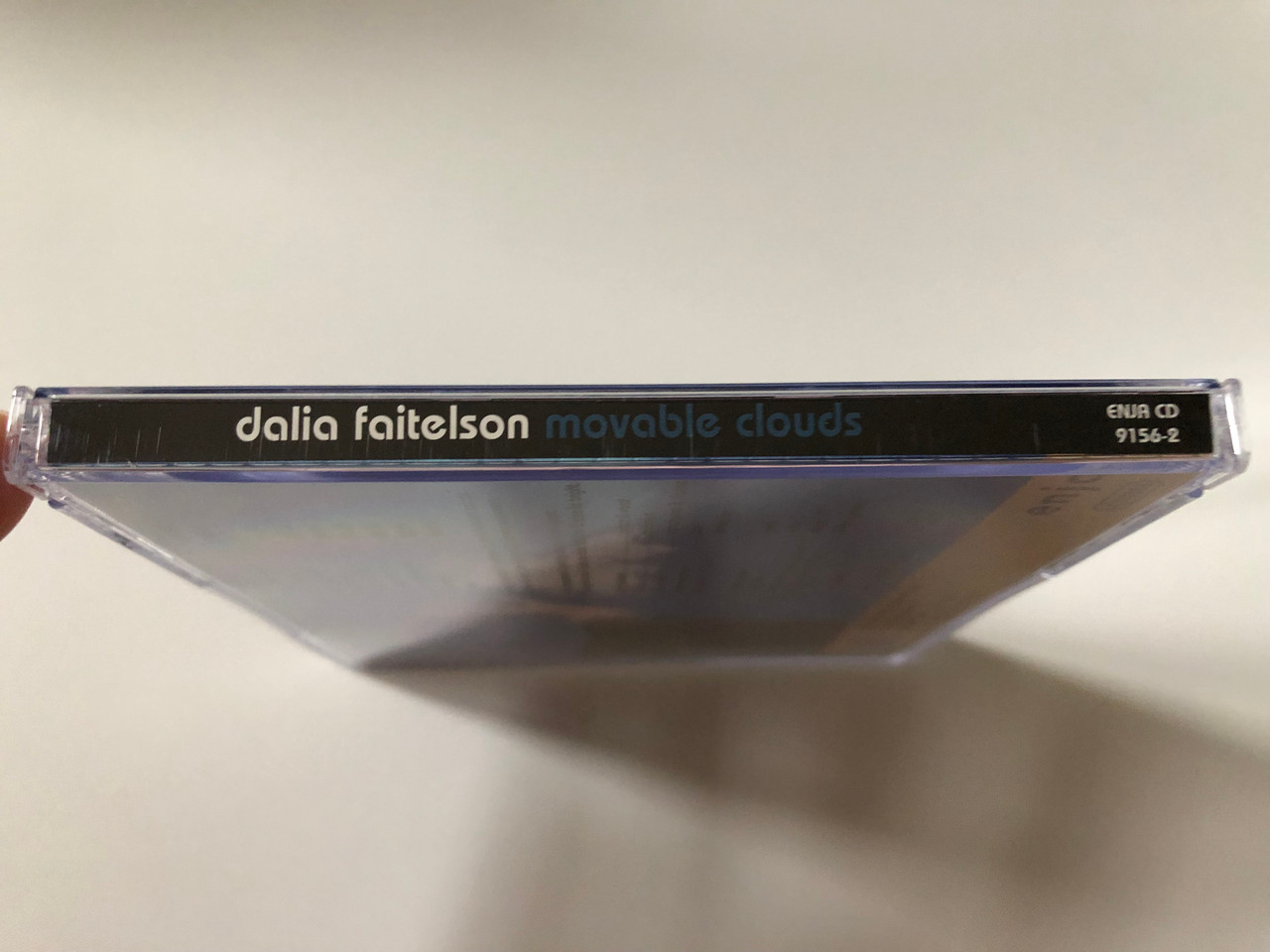 https://cdn10.bigcommerce.com/s-62bdpkt7pb/products/0/images/257915/Dalia_Faitelson_Movable_Clouds_Enja_Records_Audio_CD_2004_CD_9156-2_3__81871.1667835648.1280.1280.JPG?c=2&_gl=1*1286zfv*_ga*MjA2NTIxMjE2MC4xNTkwNTEyNTMy*_ga_WS2VZYPC6G*MTY2NzgzMzMyOS42MTkuMS4xNjY3ODM1NjQ3LjYwLjAuMA..