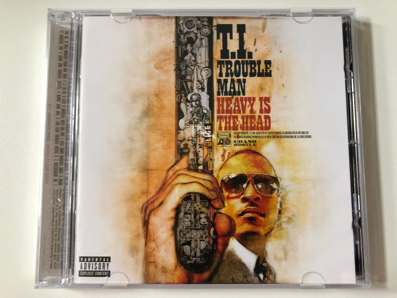https://cdn10.bigcommerce.com/s-62bdpkt7pb/products/0/images/257952/T.I._Trouble_Man_Heavy_Is_The_Head_Grand_Hustle_Audio_CD_2012_7567-87631-2_1__78195.1667844137.1280.1280.JPG?c=2&_gl=1*9j1ytk*_ga*MjA2NTIxMjE2MC4xNTkwNTEyNTMy*_ga_WS2VZYPC6G*MTY2NzgzMzMyOS42MTkuMS4xNjY3ODQ0MzQ2LjYwLjAuMA..