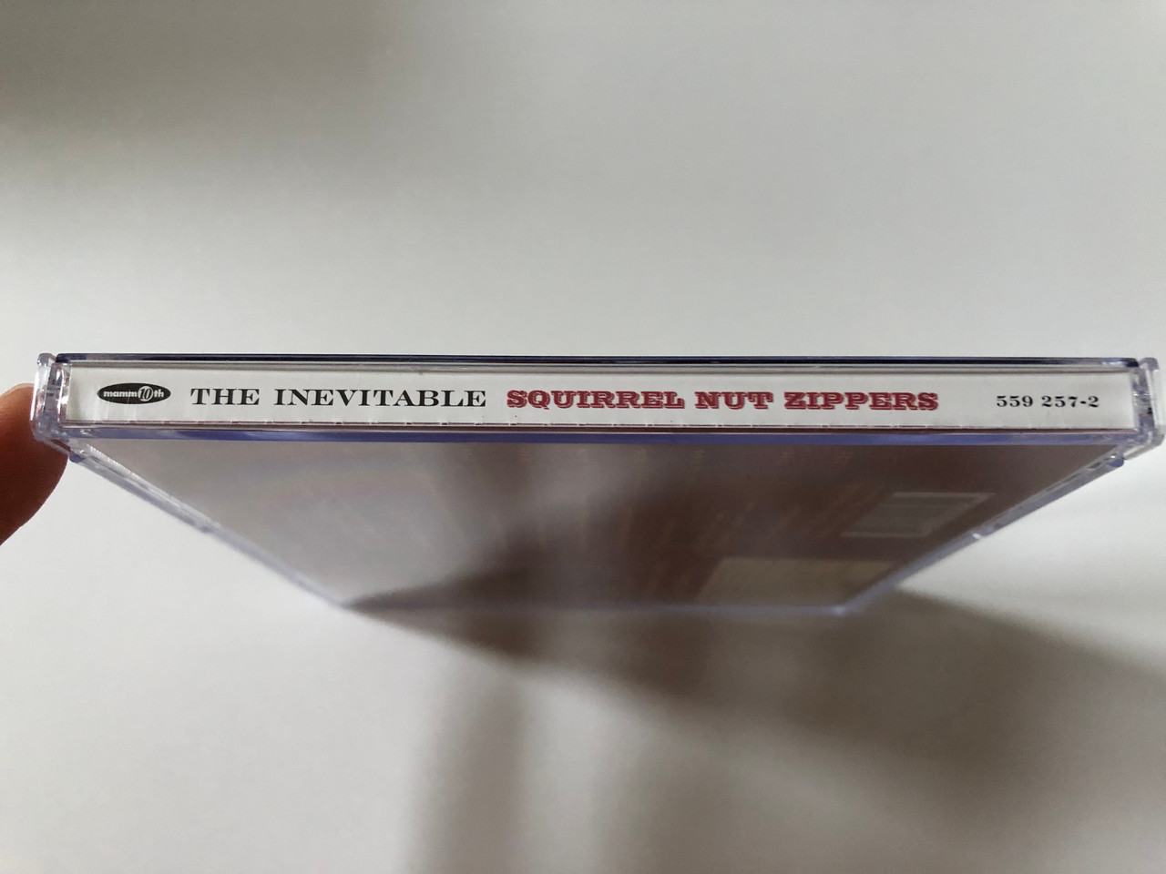 https://cdn10.bigcommerce.com/s-62bdpkt7pb/products/0/images/257957/Squirrel_Nut_Zippers_The_Inevitable_The_Mammoth_Recording_Company_of_Carrboro_Mammoth_Records_Audio_CD_1998_559_257-2_3__17064.1667918516.1280.1280.JPG?c=2&_gl=1*odjif0*_ga*MjA2NTIxMjE2MC4xNTkwNTEyNTMy*_ga_WS2VZYPC6G*MTY2NzkxNzY2My42MjAuMC4xNjY3OTE3NjYzLjYwLjAuMA..