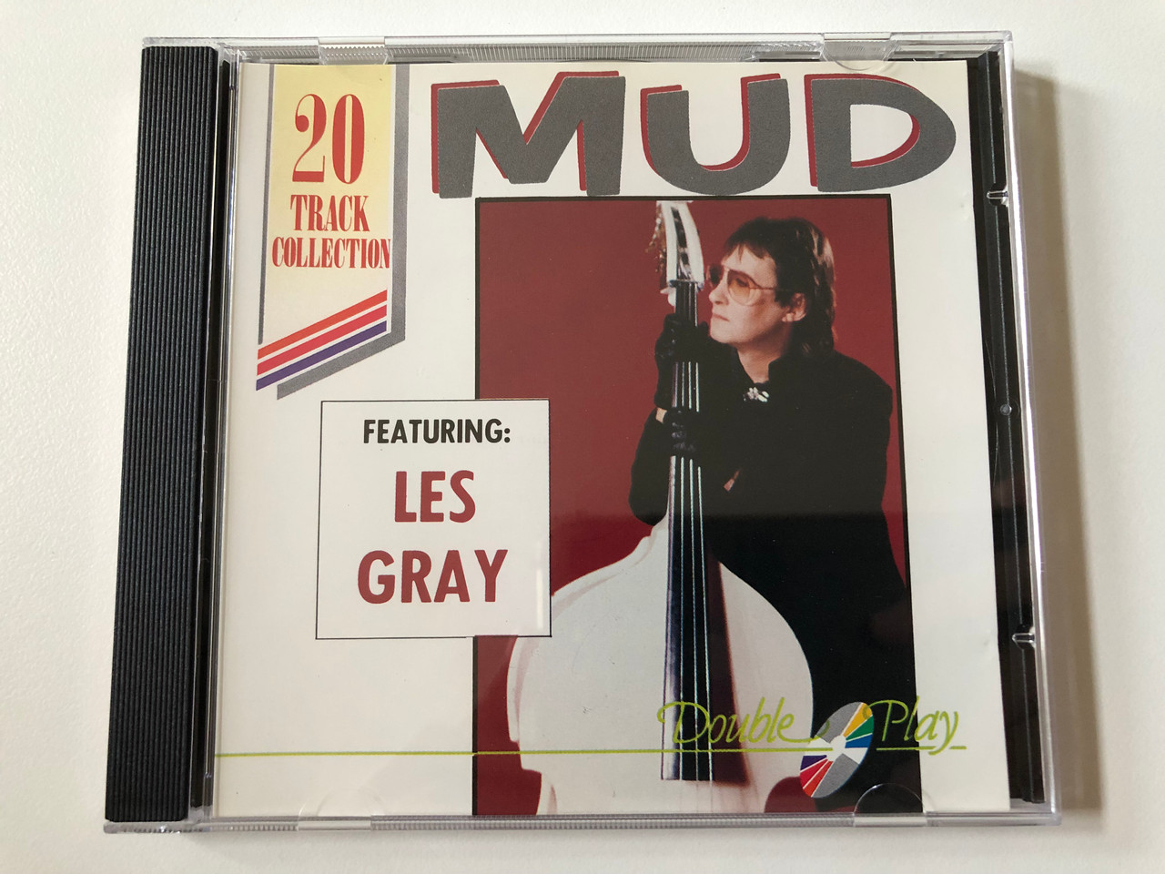 https://cdn10.bigcommerce.com/s-62bdpkt7pb/products/0/images/258217/Mud_Featuring_Les_Gray_Double_Play_20_Track_Collection_Double_Play_Audio_CD_GRF029_1__00446.1668105597.1280.1280.JPG?c=2&_gl=1*1uenktn*_ga*MjA2NTIxMjE2MC4xNTkwNTEyNTMy*_ga_WS2VZYPC6G*MTY2ODA5MDgxOC42MjQuMS4xNjY4MTA1MjU0LjUxLjAuMA..