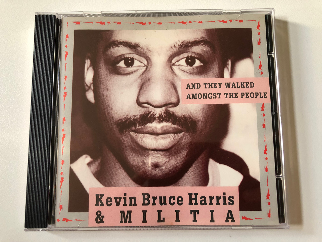 https://cdn10.bigcommerce.com/s-62bdpkt7pb/products/0/images/258650/Kevin_Bruce_Harris_Militia_And_They_Walked_Amongst_The_People_Tiptoe_Audio_CD_1989_TIPTOE_CD_888_802_1__76573.1668416438.1280.1280.JPG?c=2&_gl=1*1r90ph*_ga*MjA2NTIxMjE2MC4xNTkwNTEyNTMy*_ga_WS2VZYPC6G*MTY2ODQwNzg4NC42MjcuMS4xNjY4NDE2NDQ2LjYwLjAuMA..