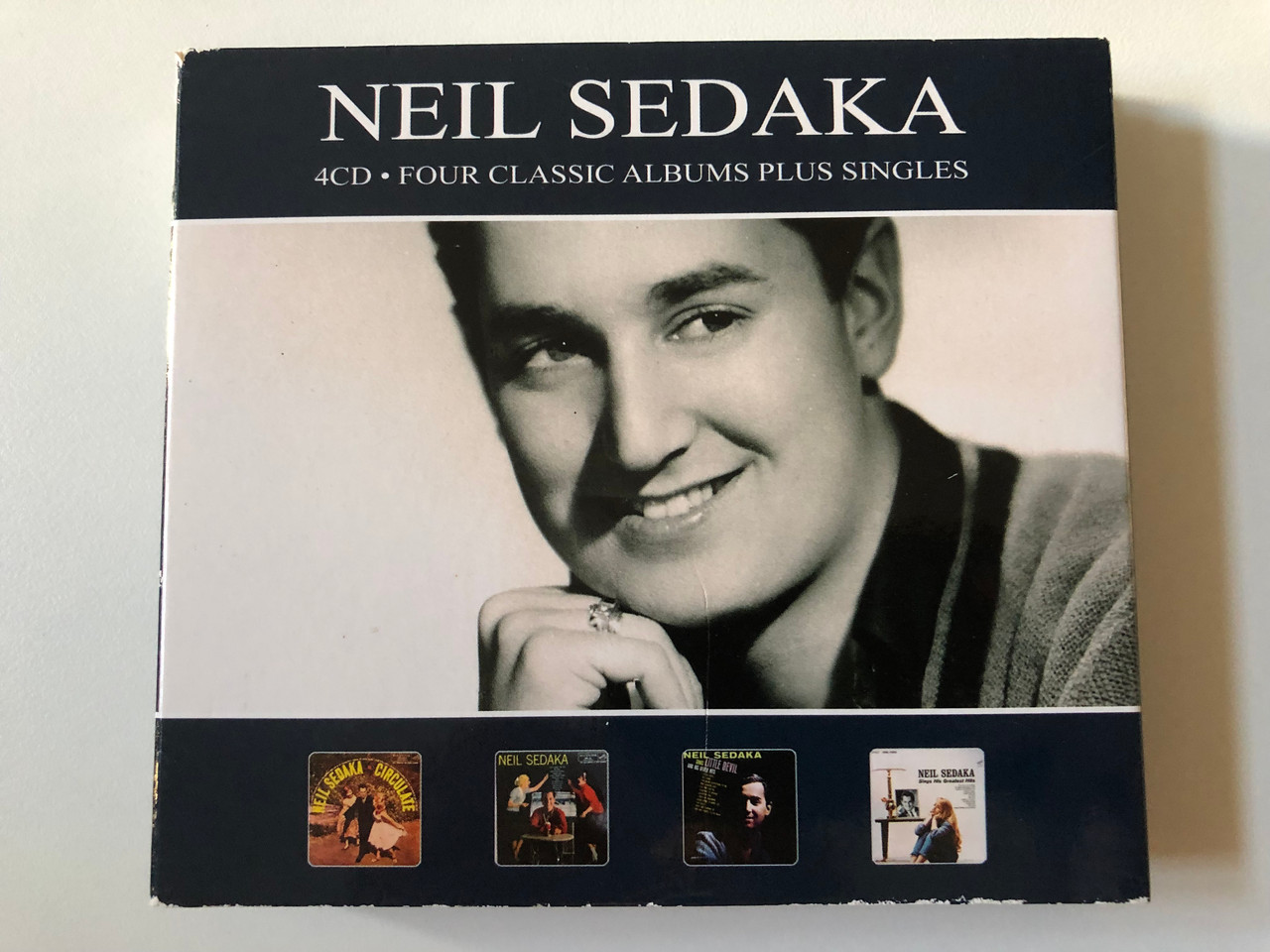 https://cdn10.bigcommerce.com/s-62bdpkt7pb/products/0/images/258785/Neil_Sedaka_Four_Classic_Albums_Plus_Singles_Reel_To_Reel_Music_Company_4x_Audio_CD_RTRCD27_1__40807.1668499419.1280.1280.JPG?c=2&_gl=1*2mftsi*_ga*MjA2NTIxMjE2MC4xNTkwNTEyNTMy*_ga_WS2VZYPC6G*MTY2ODQ4OTYyMy42MjguMS4xNjY4NDk3NzQ1LjQ0LjAuMA..