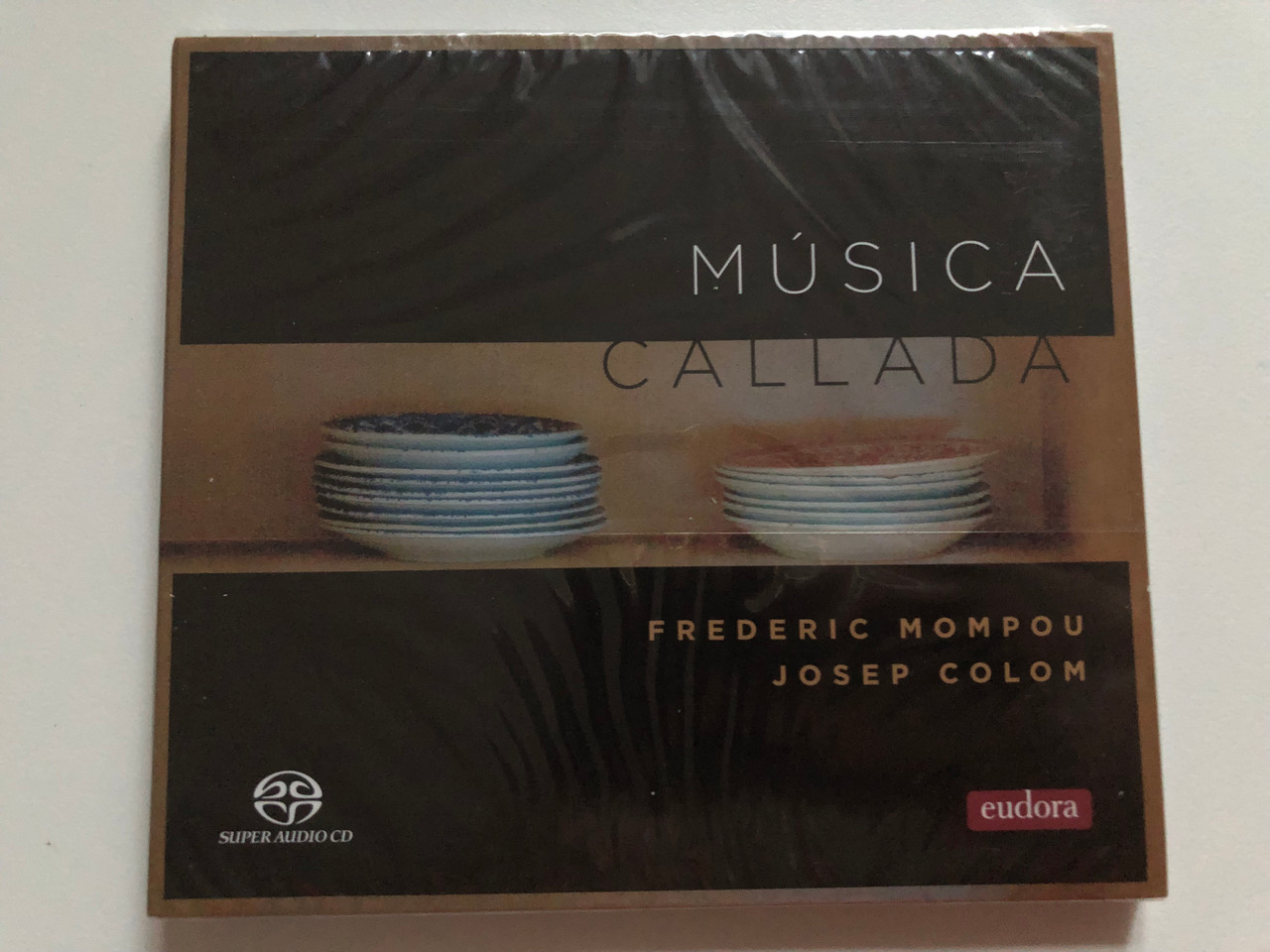 https://cdn10.bigcommerce.com/s-62bdpkt7pb/products/0/images/259081/Msica_Callada_-_Frederic_Mompou_Josep_Colom_Eudora_Records_Super_Audio_CD_2021_Stereo_EUD-SACD-2101_1__06833.1669054852.1280.1280.JPG?c=2&_gl=1*edcvqg*_ga*MjA2NTIxMjE2MC4xNTkwNTEyNTMy*_ga_WS2VZYPC6G*MTY2OTA0ODMxMS42MzYuMS4xNjY5MDU0NzQzLjU3LjAuMA..