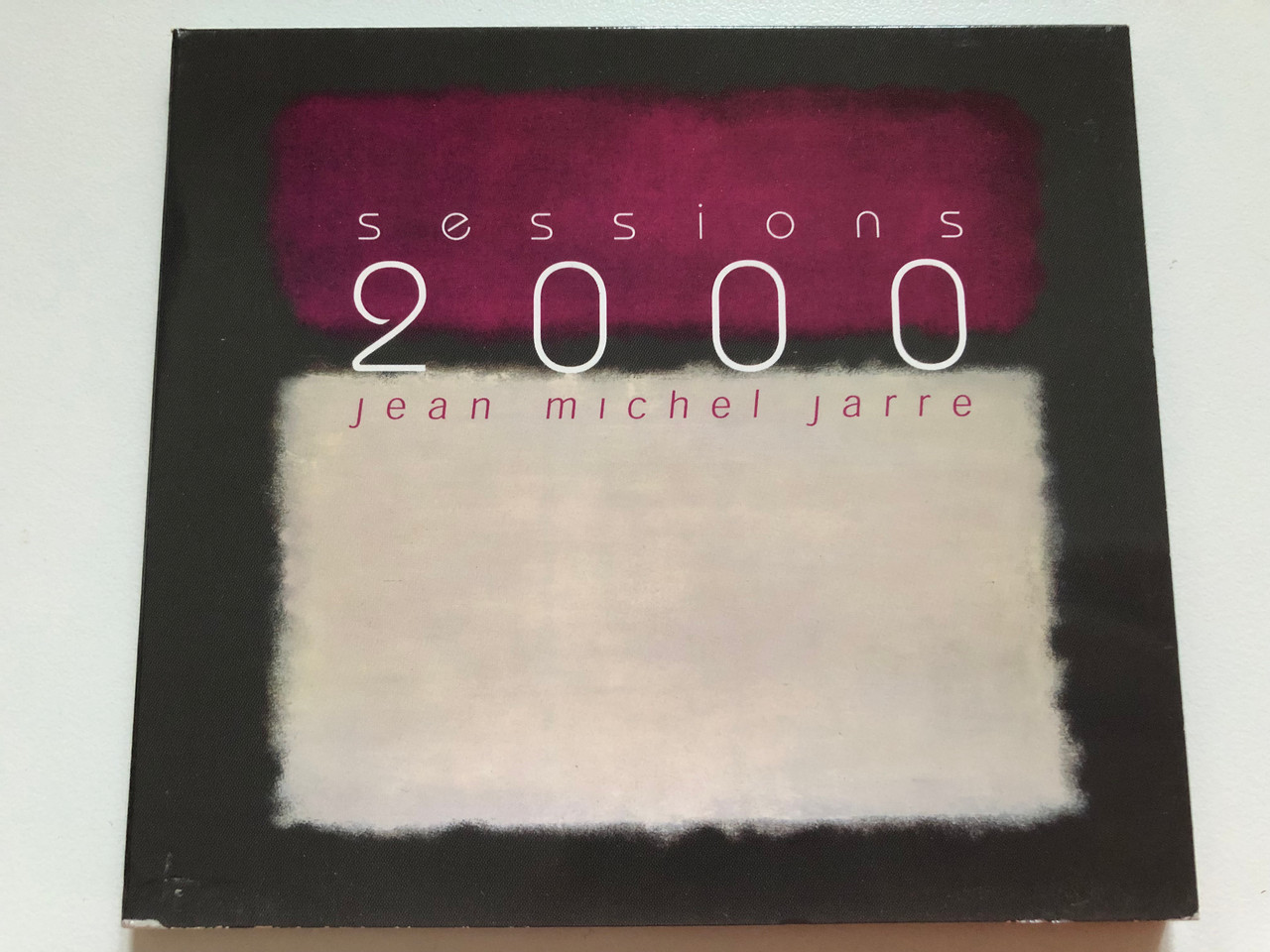https://cdn10.bigcommerce.com/s-62bdpkt7pb/products/0/images/259100/Sessions_2000_-_Jean_Michel_Jarre_Disques_Dreyfus_Audio_CD_2002_FDM_36165-2_1__78711.1669057099.1280.1280.JPG?c=2&_gl=1*158n6h7*_ga*MjA2NTIxMjE2MC4xNTkwNTEyNTMy*_ga_WS2VZYPC6G*MTY2OTA0ODMxMS42MzYuMS4xNjY5MDU3MTAxLjYwLjAuMA..