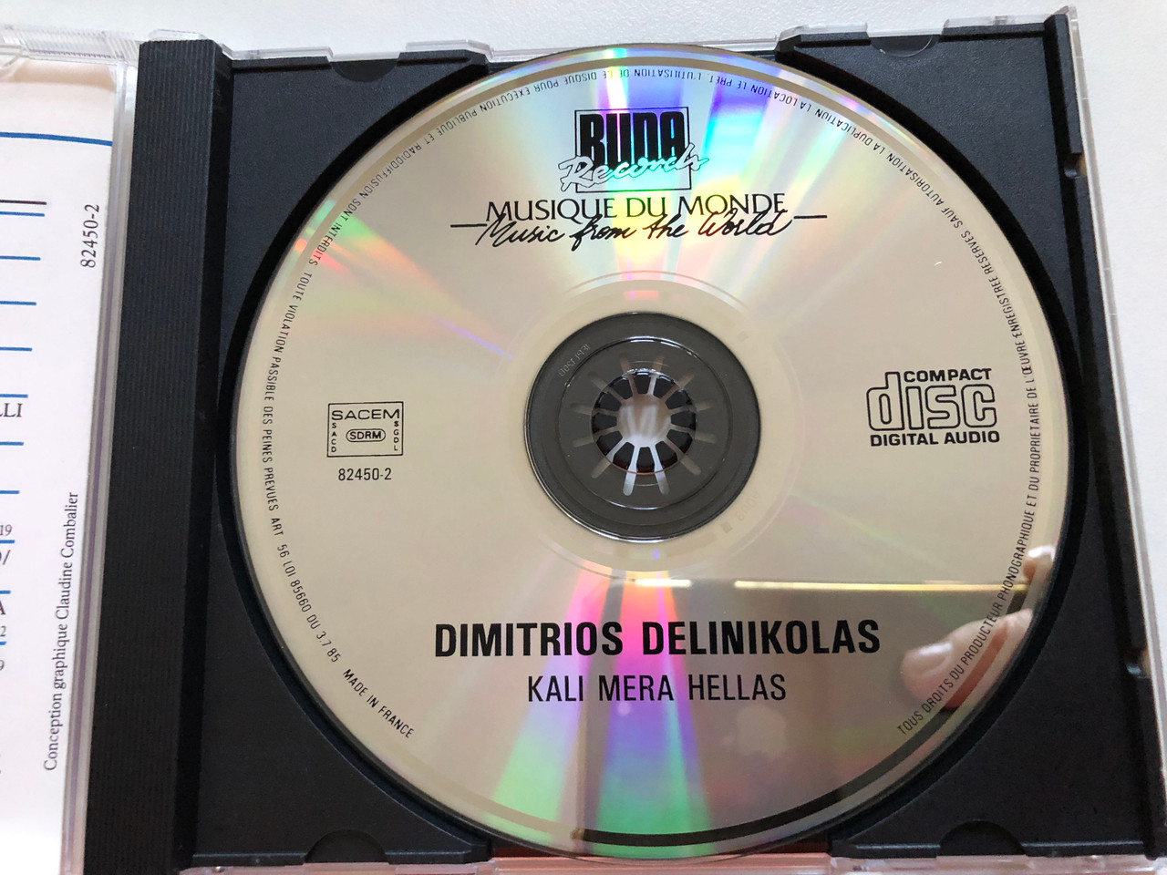 https://cdn10.bigcommerce.com/s-62bdpkt7pb/products/0/images/259187/Dimitrios_Delinikolas_Kali_Mera_Hellas_Musique_Populaire_De_Grce_Musique_Du_Monde_Music_From_the_World_Buda_Records_Audio_CD_1989_82450-2_3__51827.1669115668.1280.1280.JPG?c=2&_gl=1*1arq2gq*_ga*MjA2NTIxMjE2MC4xNTkwNTEyNTMy*_ga_WS2VZYPC6G*MTY2OTEwODAwNS42MzcuMS4xNjY5MTE1NjQ4LjYwLjAuMA..