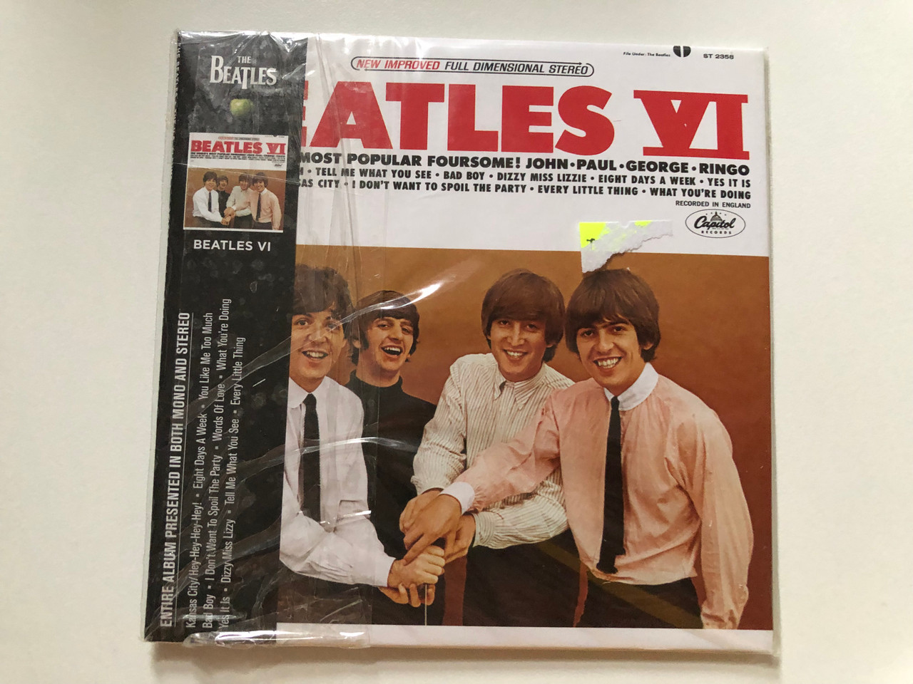 https://cdn10.bigcommerce.com/s-62bdpkt7pb/products/0/images/259342/Beatles_VI_John_Paul_George_Ringo_Tell_Me_What_You_See_Bad_Boy_Dizzy_Miss_Lizzie_Eight_Days_A_Week_Yes_It_Is_I_Dont_Want_To_Spoil_The_Party_Every_Little_Thing_What_Youre_Doing_1__77932.1669200406.1280.1280.JPG?c=2&_gl=1*4b73f6*_ga*MjA2NTIxMjE2MC4xNTkwNTEyNTMy*_ga_WS2VZYPC6G*MTY2OTE4OTY1NS42MzkuMS4xNjY5MjAwMTUwLjI5LjAuMA..