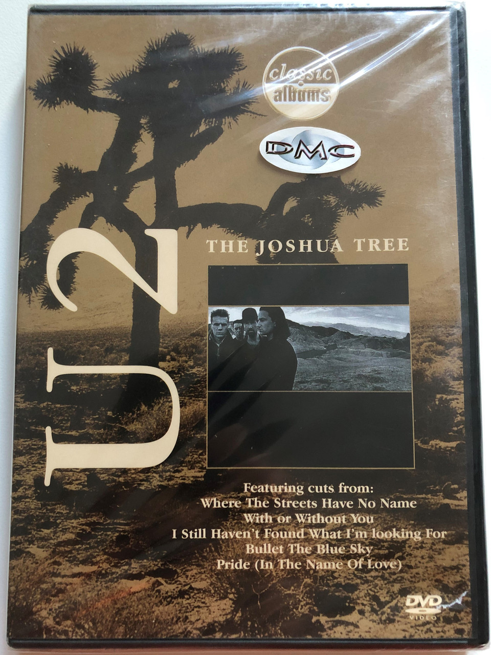 https://cdn10.bigcommerce.com/s-62bdpkt7pb/products/0/images/259522/U2_The_Joshua_Tree_Classic_Albums_Featuring_cuts_from_Where_The_Streets_Have_No_Name_With_Or_Without_You_I_Still_Havent_Found_What_Im_Looking_For_Bullet_The_Blue_Sky_Eagle_Rock_Enter_1__58120.1669378948.1280.1280.JPG?c=2&_gl=1*189r50b*_ga*MjA2NTIxMjE2MC4xNTkwNTEyNTMy*_ga_WS2VZYPC6G*MTY2OTM3MzQ2NS42NDUuMS4xNjY5Mzc4NzgxLjQ1LjAuMA..