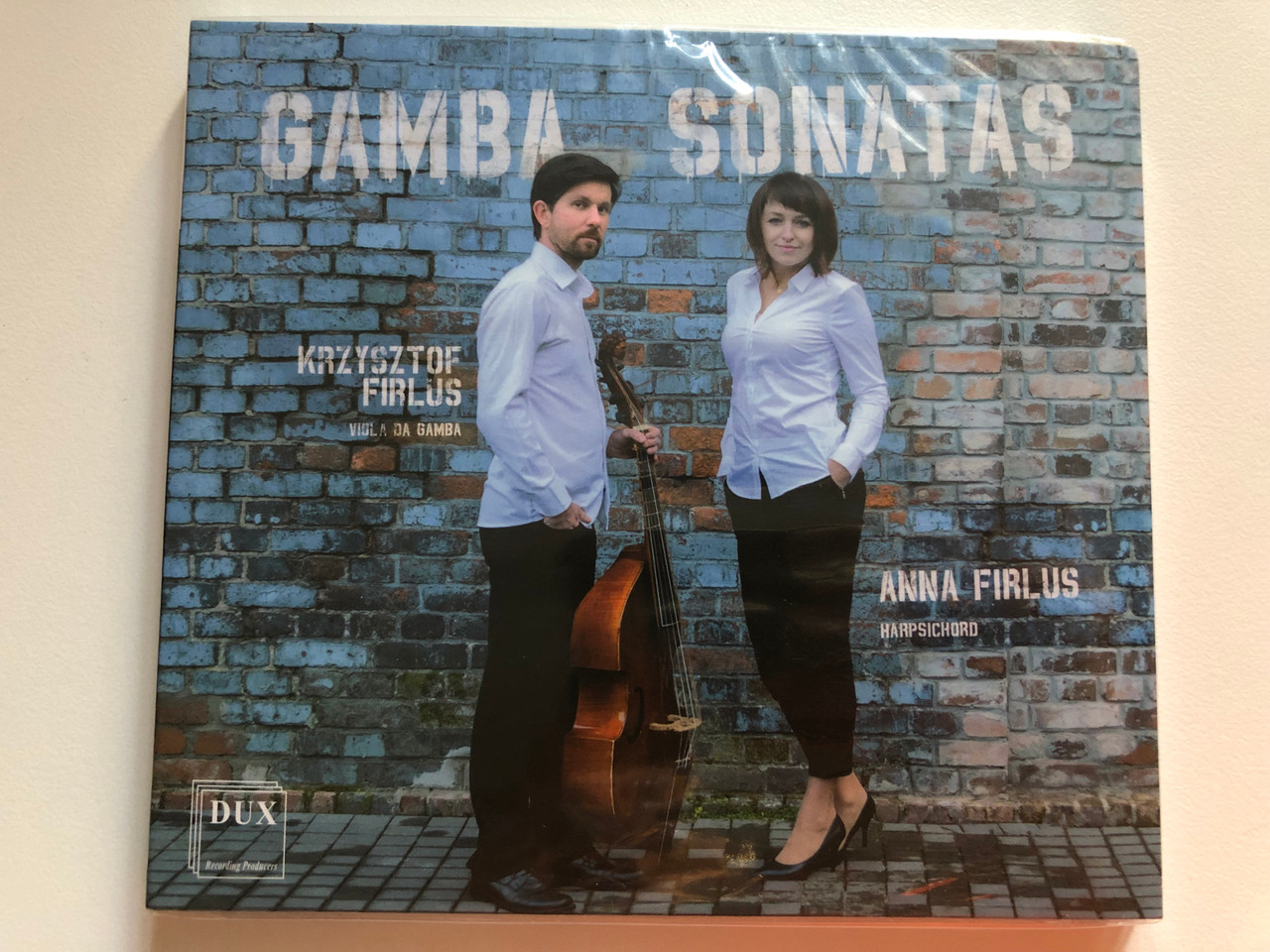 https://cdn10.bigcommerce.com/s-62bdpkt7pb/products/0/images/259566/Gamba_Sonatas_-_Krzysztof_Firlus_viola_da_gamba_Anna_Firlus_harpsichord_DUX_Recording_Producers_Audio_CD_2018_DUX_1471_1__87997.1669631761.1280.1280.JPG?c=2&_gl=1*w19ch0*_ga*MjA2NTIxMjE2MC4xNTkwNTEyNTMy*_ga_WS2VZYPC6G*MTY2OTYyNTQ1MS42NDcuMS4xNjY5NjMxNzY4LjYwLjAuMA..