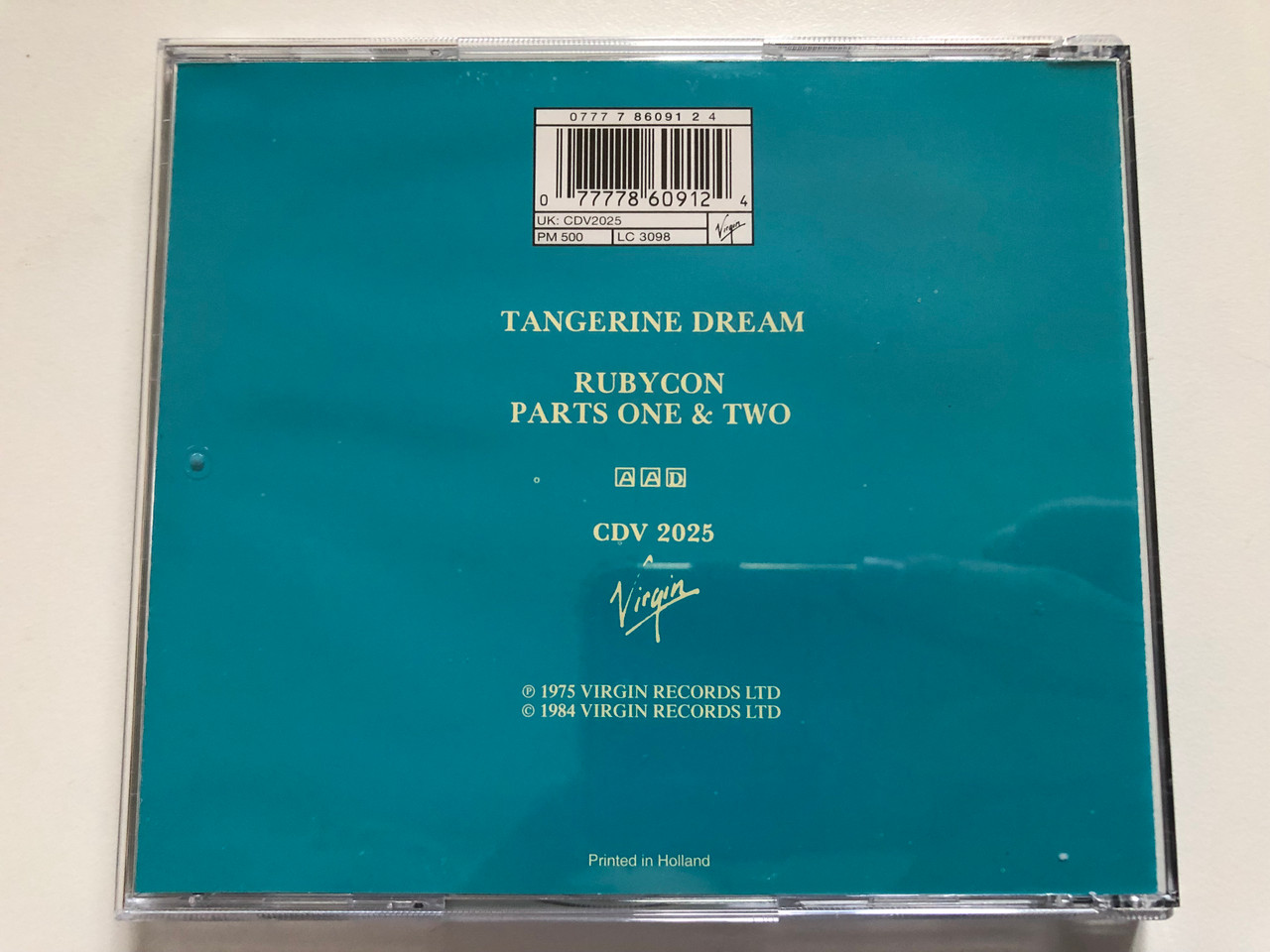 https://cdn10.bigcommerce.com/s-62bdpkt7pb/products/0/images/259593/Tangerine_Dream_Rubycon_Virgin_Audio_CD_CDV_2025_4__49972.1669636730.1280.1280.JPG?c=2&_gl=1*19wc7yq*_ga*MjA2NTIxMjE2MC4xNTkwNTEyNTMy*_ga_WS2VZYPC6G*MTY2OTYyNTQ1MS42NDcuMS4xNjY5NjM2NzIyLjYwLjAuMA..