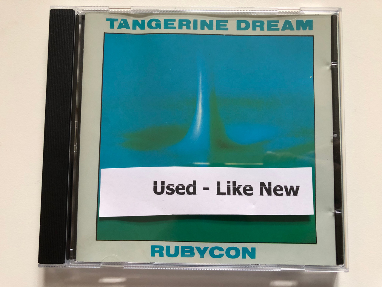 https://cdn10.bigcommerce.com/s-62bdpkt7pb/products/0/images/259595/Tangerine_Dream_Rubycon_Virgin_Audio_CD_CDV_2025_6__03013.1669636740.1280.1280.JPG?c=2&_gl=1*19wc7yq*_ga*MjA2NTIxMjE2MC4xNTkwNTEyNTMy*_ga_WS2VZYPC6G*MTY2OTYyNTQ1MS42NDcuMS4xNjY5NjM2NzIyLjYwLjAuMA..