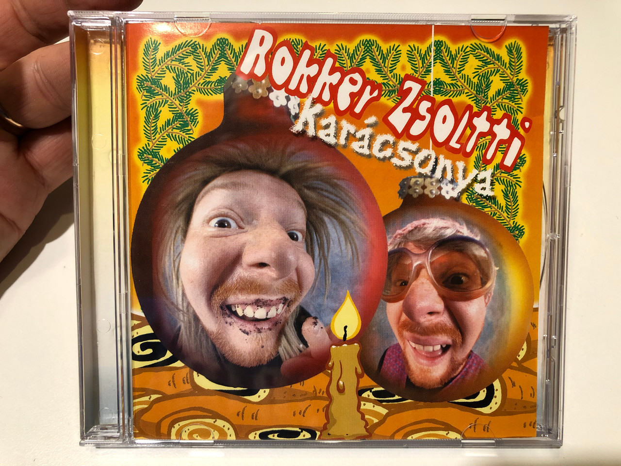 https://cdn10.bigcommerce.com/s-62bdpkt7pb/products/0/images/259756/Rokker_Zsoltti_Karacsony_Poetix_Records_Audio_CD_2006_B68_764-2_1__00926.1669798306.1280.1280.JPG?c=2&_gl=1*1p3jgvc*_ga*MjA2NTIxMjE2MC4xNTkwNTEyNTMy*_ga_WS2VZYPC6G*MTY2OTc4ODU4MS42NTEuMS4xNjY5Nzk4MTUwLjUzLjAuMA..