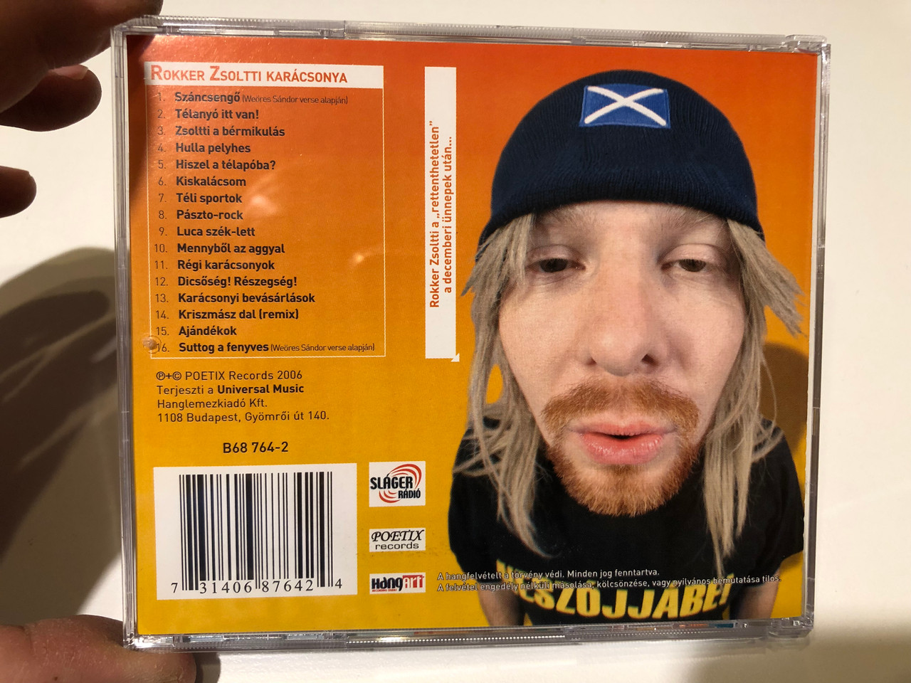 https://cdn10.bigcommerce.com/s-62bdpkt7pb/products/0/images/259757/Rokker_Zsoltti_Karacsony_Poetix_Records_Audio_CD_2006_B68_764-2_2__68573.1669798318.1280.1280.JPG?c=2&_gl=1*1p3jgvc*_ga*MjA2NTIxMjE2MC4xNTkwNTEyNTMy*_ga_WS2VZYPC6G*MTY2OTc4ODU4MS42NTEuMS4xNjY5Nzk4MTUwLjUzLjAuMA..