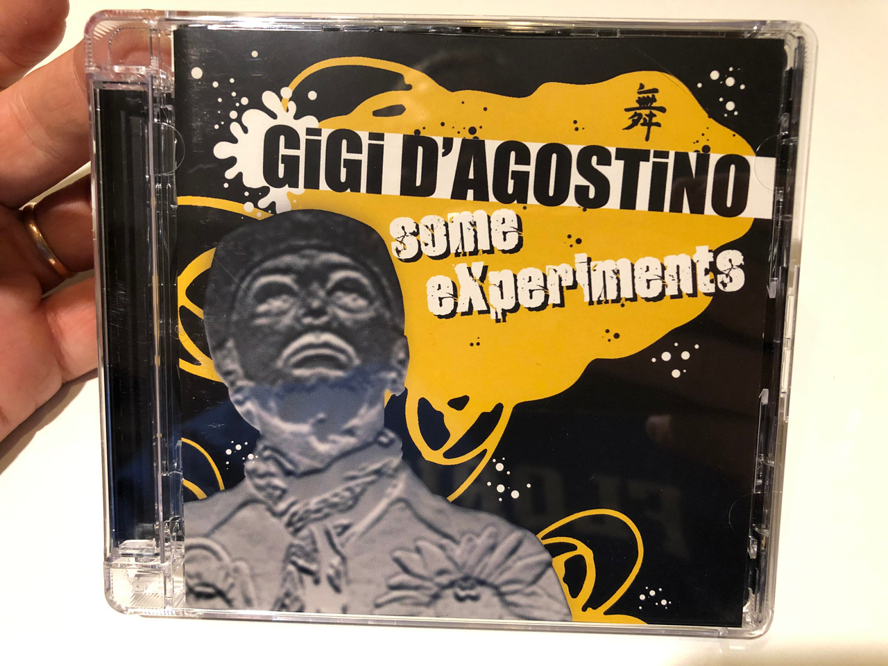 https://cdn10.bigcommerce.com/s-62bdpkt7pb/products/0/images/259762/Gigi_DAgostino_Some_Experiments_NoiseMaker_2x_Audio_CD_2006_NM066_CD_DP_1__50103.1669799174.1280.1280.JPG?c=2&_gl=1*1ns0bbm*_ga*MjA2NTIxMjE2MC4xNTkwNTEyNTMy*_ga_WS2VZYPC6G*MTY2OTc4ODU4MS42NTEuMS4xNjY5Nzk5MDgxLjUwLjAuMA..