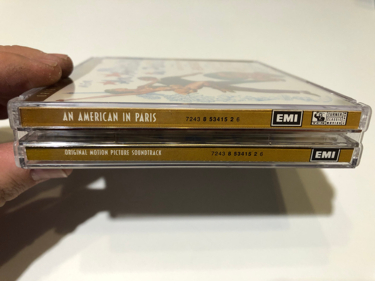 https://cdn10.bigcommerce.com/s-62bdpkt7pb/products/0/images/259768/An_American_In_Paris_Original_Motion_Picture_Soundtrack_-_To_The_Music_of_George_Gershwin_Starring_Gene_Kelly_and_introducing_Leslie_Caron_with_Oscar_Levant_Georges_Guetary_Nina_Foch_3__93009.1669800377.1280.1280.JPG?c=2&_gl=1*1v56mhx*_ga*MjA2NTIxMjE2MC4xNTkwNTEyNTMy*_ga_WS2VZYPC6G*MTY2OTc4ODU4MS42NTEuMS4xNjY5ODAwMTA2LjQyLjAuMA..
