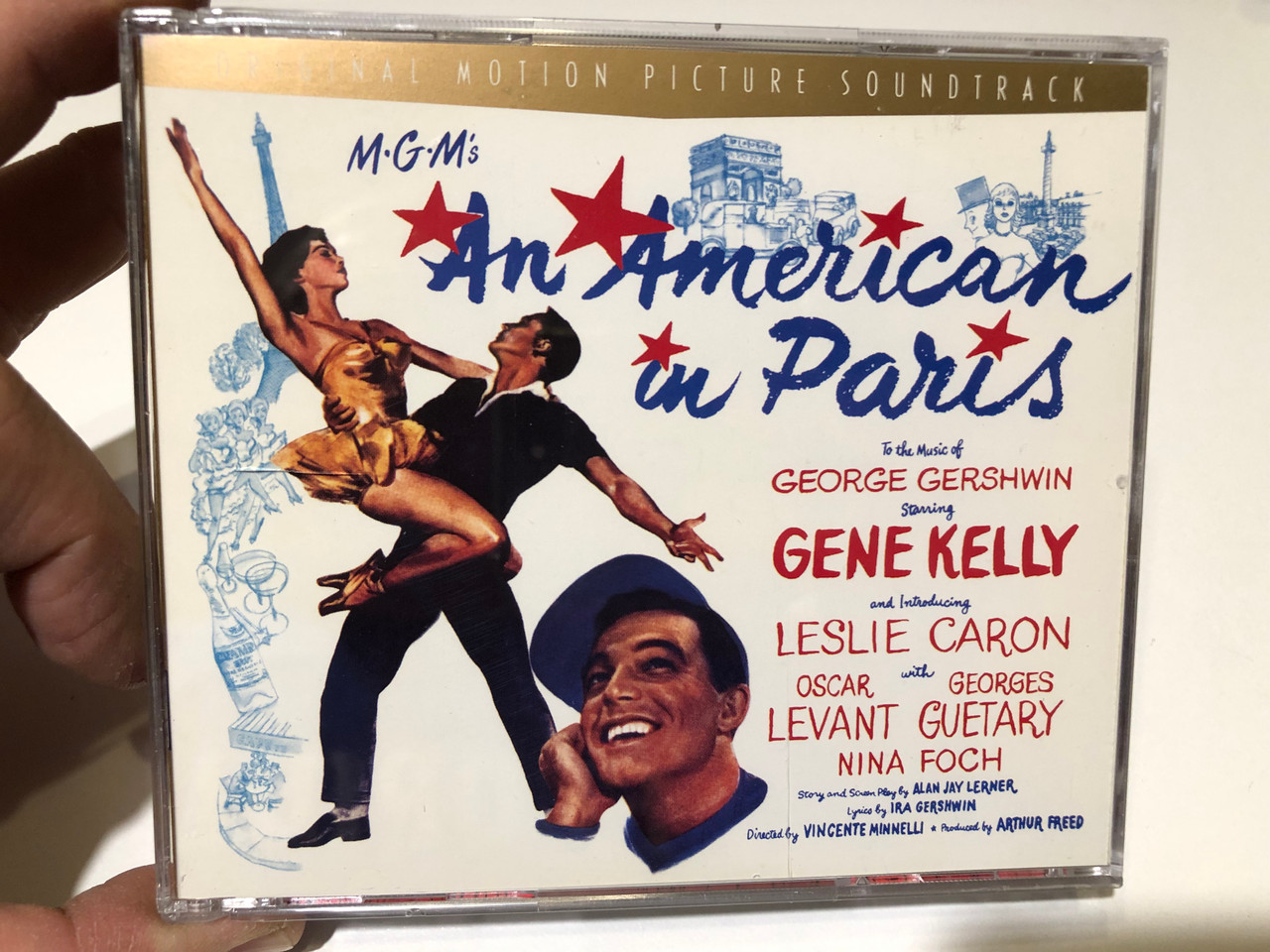 https://cdn10.bigcommerce.com/s-62bdpkt7pb/products/0/images/259770/An_American_In_Paris_Original_Motion_Picture_Soundtrack_-_To_The_Music_of_George_Gershwin_Starring_Gene_Kelly_and_introducing_Leslie_Caron_with_Oscar_Levant_Georges_Guetary_Nina_Foch_EM_1__35608.1669800398.1280.1280.JPG?c=2&_gl=1*1v56mhx*_ga*MjA2NTIxMjE2MC4xNTkwNTEyNTMy*_ga_WS2VZYPC6G*MTY2OTc4ODU4MS42NTEuMS4xNjY5ODAwMTA2LjQyLjAuMA..