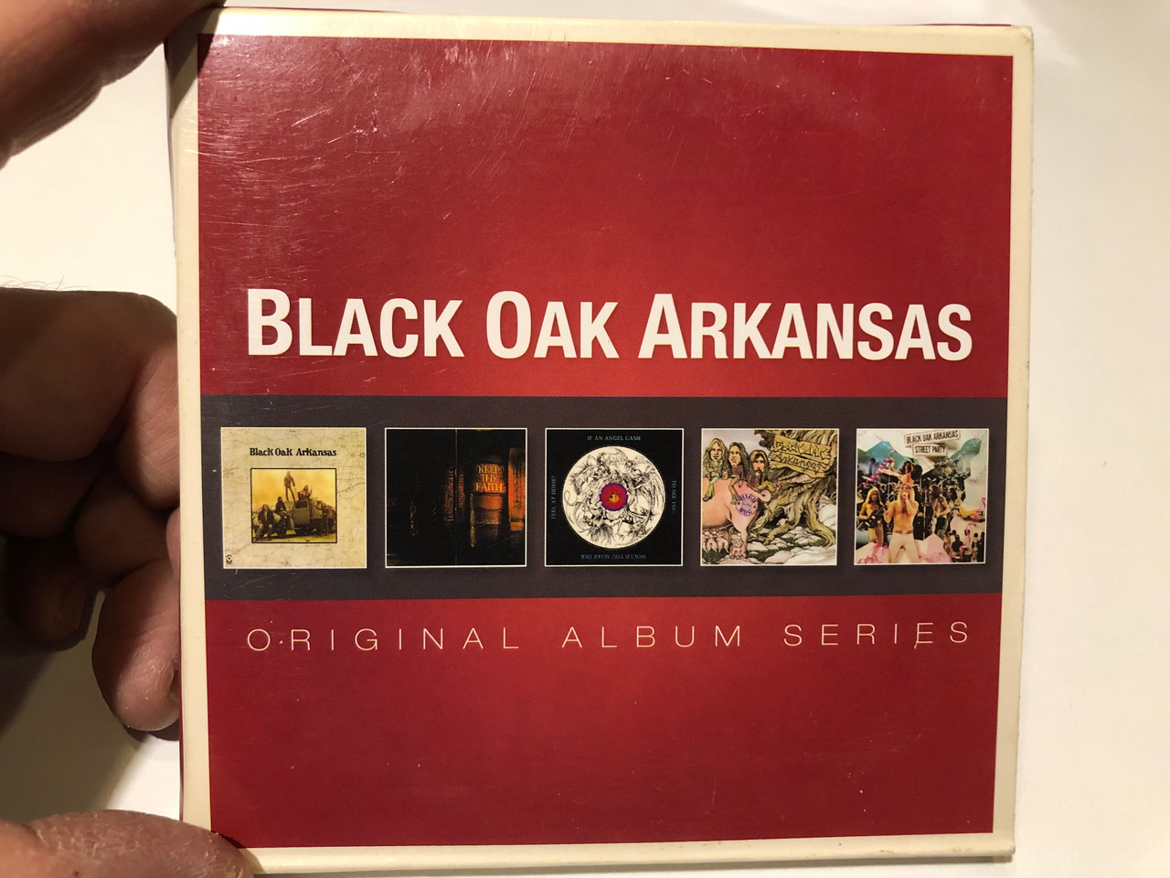 https://cdn10.bigcommerce.com/s-62bdpkt7pb/products/0/images/259805/Black_Oak_Arkansas_Original_Album_Series_Original_Album_Series_Rhino_Records_5x_Audio_CD_Box_Set_2013_8122796837_1__96900.1669892699.1280.1280.JPG?c=2&_gl=1*10g46c*_ga*MjA2NTIxMjE2MC4xNTkwNTEyNTMy*_ga_WS2VZYPC6G*MTY2OTg5MTEwMy42NTMuMS4xNjY5ODkyMzk5LjU4LjAuMA..