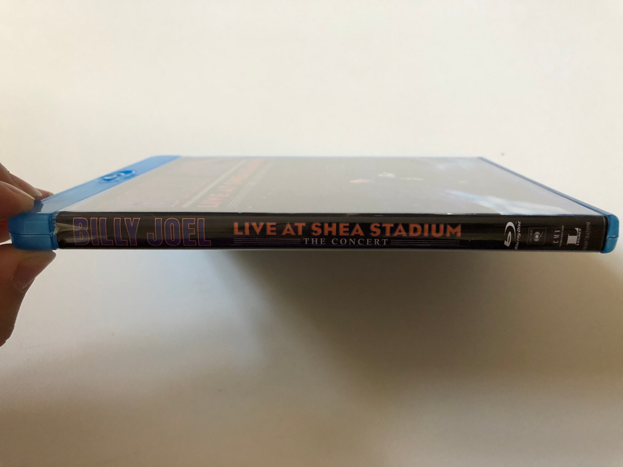 https://cdn10.bigcommerce.com/s-62bdpkt7pb/products/0/images/259851/Billy_Joel_Live_At_Shea_Stadium_The_Concert_Sony_Music_Blu-ray_Disc_2011_88697845959_3__20409.1669914407.1280.1280.JPG?c=2&_gl=1*1wgdo40*_ga*MjA2NTIxMjE2MC4xNTkwNTEyNTMy*_ga_WS2VZYPC6G*MTY2OTkxMjM2OC42NTUuMS4xNjY5OTE0NDQxLjE2LjAuMA..