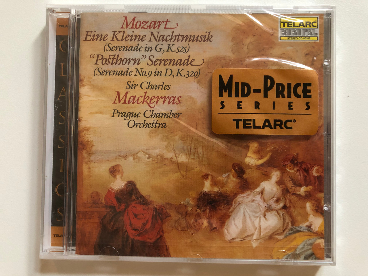 https://cdn10.bigcommerce.com/s-62bdpkt7pb/products/0/images/260680/Mozart_-_Eine_Kleine_Nachtmusik_Serenade_In_G_K._525_Posthorn_Serenade_Serenade_No._9_In_D_K._320_-_Sir_Charles_Mackerras_Prague_Chamber_Orchestra_Telarc_Audio_CD_1985_CD-80108_1__25545.1670852539.1280.1280.JPG?c=2&_gl=1*1st28jm*_ga*MjA2NTIxMjE2MC4xNTkwNTEyNTMy*_ga_WS2VZYPC6G*MTY3MDg0NzU2MS42NjYuMS4xNjcwODUyMjY3LjQzLjAuMA..