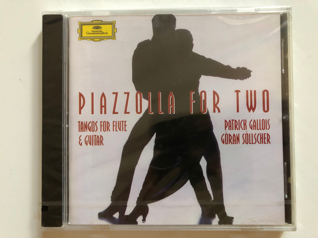 https://cdn10.bigcommerce.com/s-62bdpkt7pb/products/0/images/260847/Piazzolla_For_Two_-_Tangos_For_Flute_Guitar_-_Patrick_Gallois_Gran_Sllscher_Deutsche_Grammophon_Audio_CD_1996_449_185-2_1__17145.1670951897.1280.1280.JPG?c=2&_gl=1*1nc18ap*_ga*MjA2NTIxMjE2MC4xNTkwNTEyNTMy*_ga_WS2VZYPC6G*MTY3MDk0NjE5NS42NjguMS4xNjcwOTUxODA3LjU3LjAuMA..