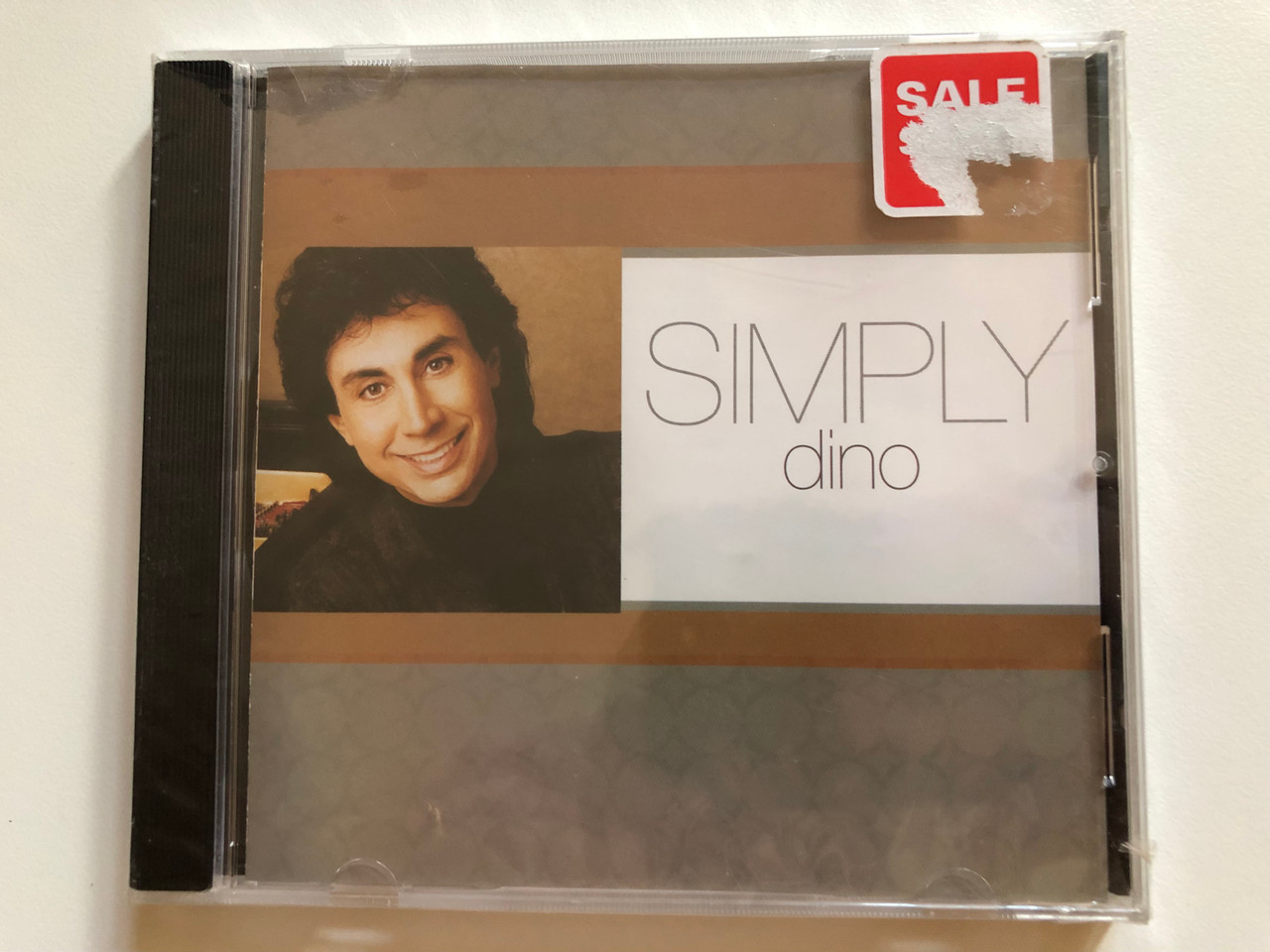 https://cdn10.bigcommerce.com/s-62bdpkt7pb/products/0/images/260853/Simply_Dino_Provident_Label_Group_Audio_CD_2005_83061-0787-2_1__34571.1670952946.1280.1280.JPG?c=2&_gl=1*1kjdzp8*_ga*MjA2NTIxMjE2MC4xNTkwNTEyNTMy*_ga_WS2VZYPC6G*MTY3MDk0NjE5NS42NjguMS4xNjcwOTUyNzY3LjI1LjAuMA..