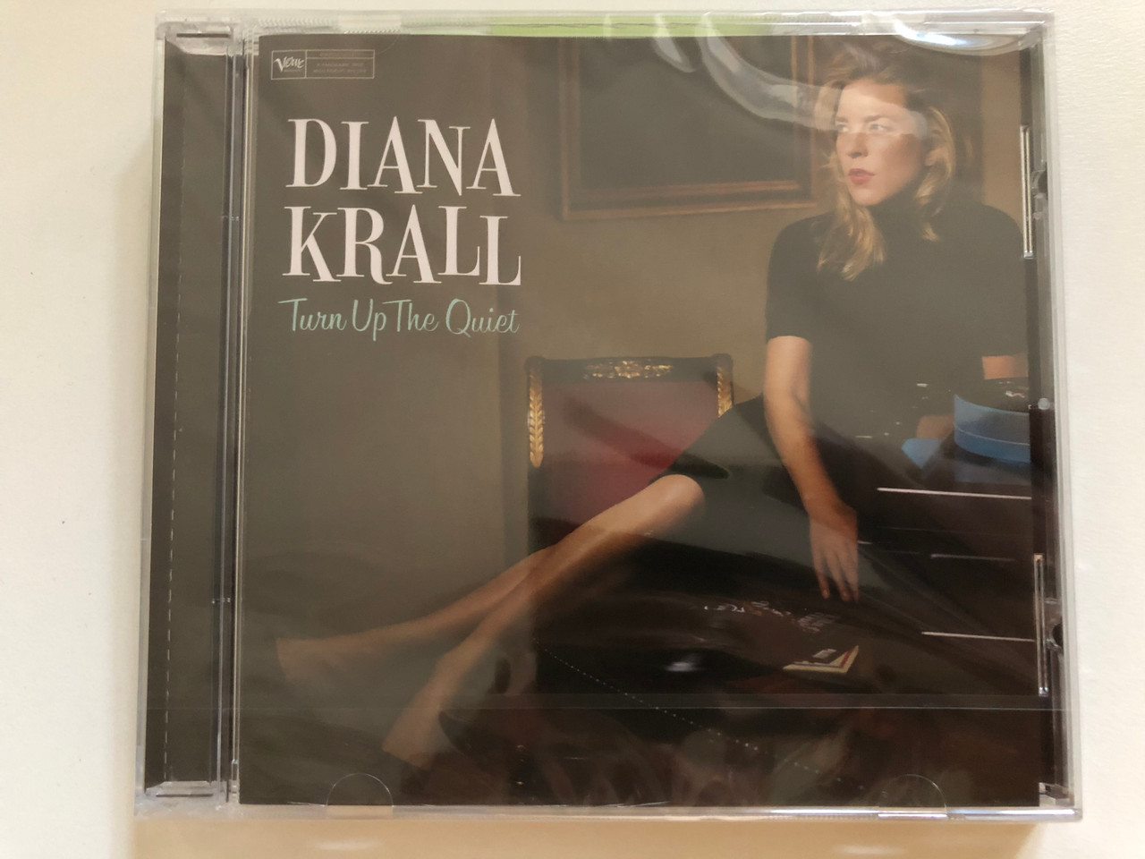 https://cdn10.bigcommerce.com/s-62bdpkt7pb/products/0/images/260883/Diana_Krall_Turn_Up_The_Quiet_Verve_Records_Audio_CD_2017_00602557352177_1__34079.1671001873.1280.1280.JPG?c=2&_gl=1*1qc12i7*_ga*MjA2NTIxMjE2MC4xNTkwNTEyNTMy*_ga_WS2VZYPC6G*MTY3MTAwMDI1NS42NjkuMS4xNjcxMDAxNzE1LjYwLjAuMA..