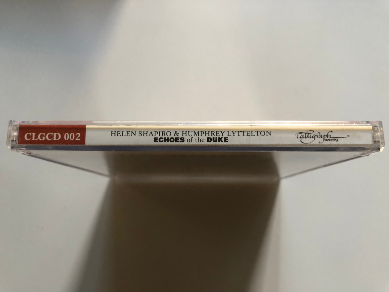 https://cdn10.bigcommerce.com/s-62bdpkt7pb/products/0/images/261482/Helen_Shapiro_Humphrey_Lyttelton_Echoes_Of_The_Duke_Calligraph_Records_Audio_CD_1985_CLGCD_002_3__27691.1671478752.1280.1280.JPG?c=2&_gl=1*1buz28d*_ga*MjA2NTIxMjE2MC4xNTkwNTEyNTMy*_ga_WS2VZYPC6G*MTY3MTQ2ODAyNS42NzYuMS4xNjcxNDc4NDA4LjU3LjAuMA..