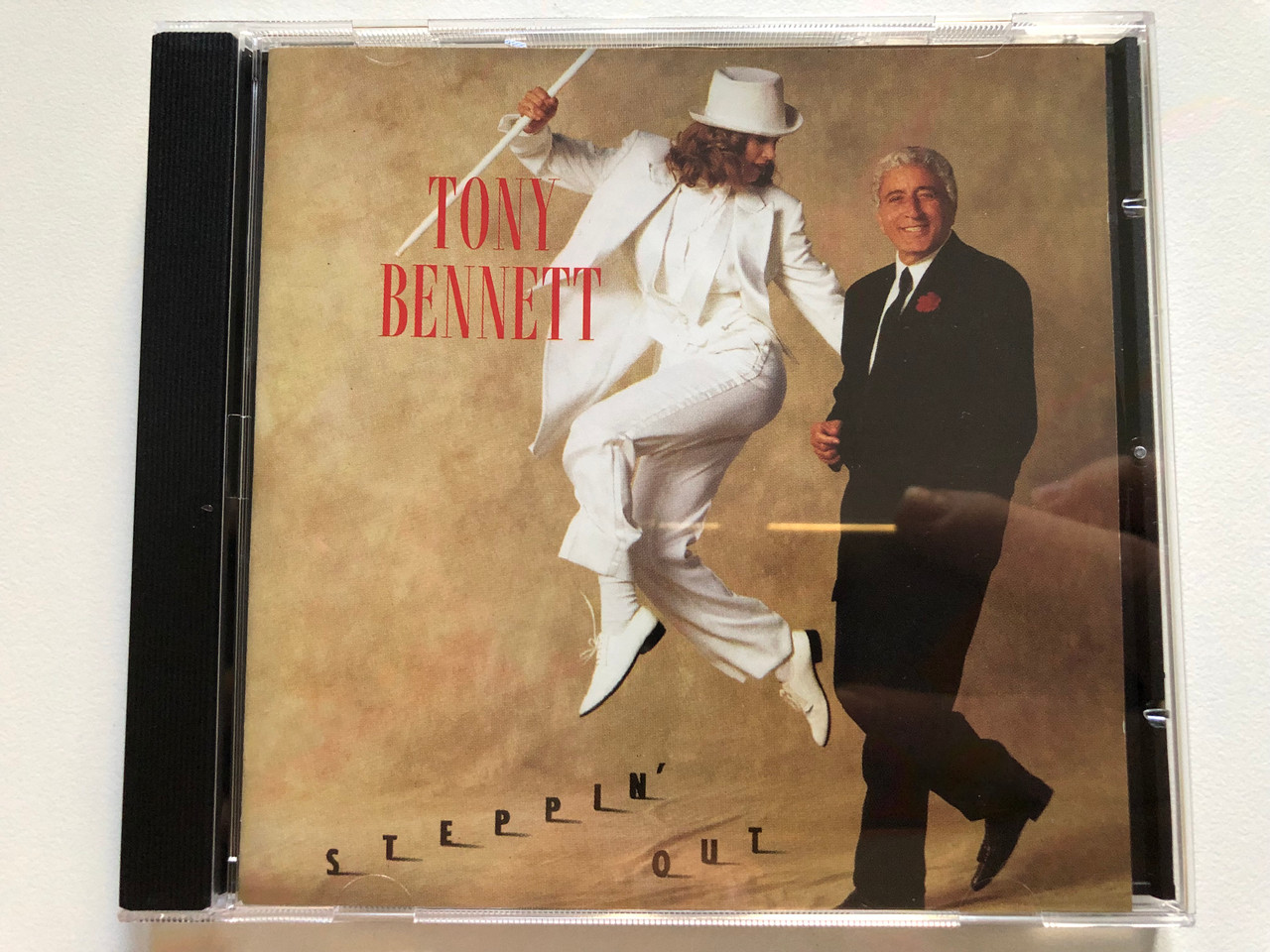 https://cdn10.bigcommerce.com/s-62bdpkt7pb/products/0/images/261526/Tony_Bennett_Steppin_Out_Columbia_Audio_CD_1993_COL_474360_2_1__58023.1671547849.1280.1280.JPG?c=2&_gl=1*1r2ataf*_ga*MjA2NTIxMjE2MC4xNTkwNTEyNTMy*_ga_WS2VZYPC6G*MTY3MTU0NzQ4NS42NzkuMC4xNjcxNTQ3NDg1LjYwLjAuMA..