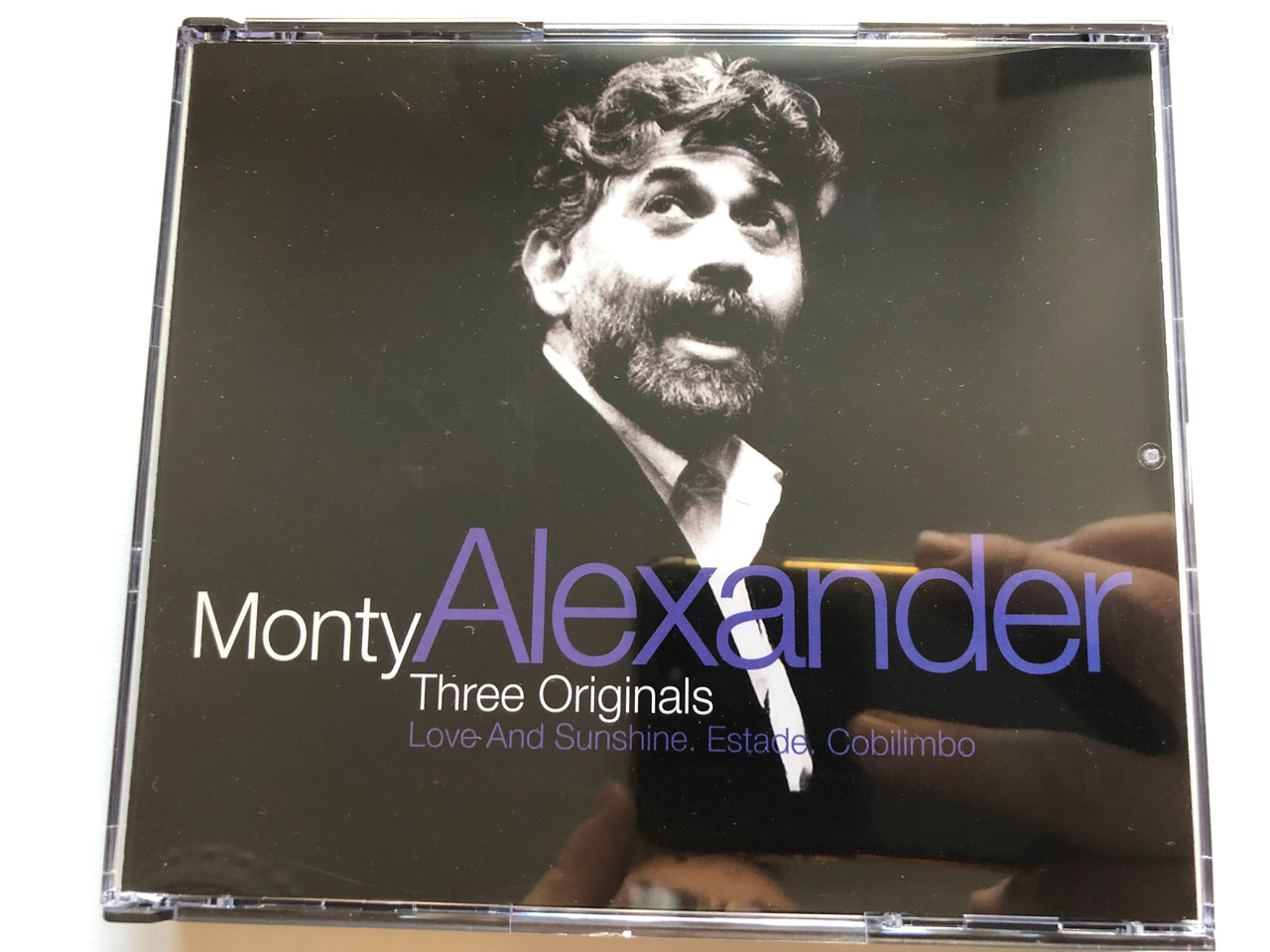 https://cdn10.bigcommerce.com/s-62bdpkt7pb/products/0/images/261541/Monty_Alexander_Three_Originals_Love_And_Sunshine._Estade._Cobilimbo_MPS_Records_2x_Audio_CD_1994_523_526-2_1__59930.1671549976.1280.1280.JPG?c=2&_gl=1*1lh5rlu*_ga*MjA2NTIxMjE2MC4xNTkwNTEyNTMy*_ga_WS2VZYPC6G*MTY3MTU0NzQ4NS42NzkuMS4xNjcxNTQ5ODQ5LjQyLjAuMA..