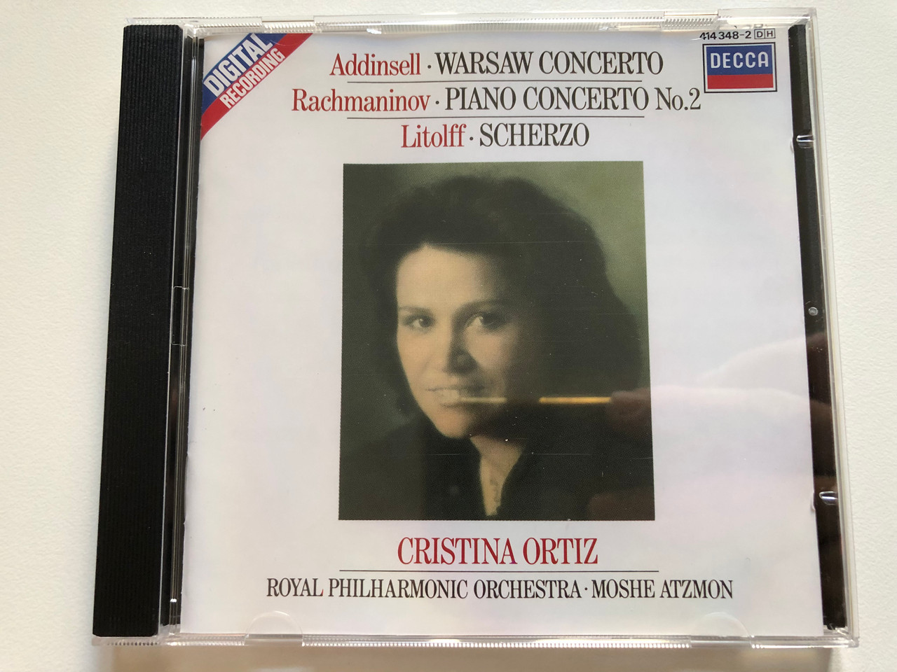 https://cdn10.bigcommerce.com/s-62bdpkt7pb/products/0/images/261576/Addinsell_-_Warsaw_Concerto_Rachmaninov_-_Piano_Concerto_No.2_Litolff_-_Scherzo_Cristina_Ortiz_Royal_Philharmonic_Orchestra_Moshe_Atzmon_Decca_Audio_CD_1986_414_348-2_DH_1__93174.1671609758.1280.1280.JPG?c=2&_gl=1*1c321np*_ga*MjA2NTIxMjE2MC4xNTkwNTEyNTMy*_ga_WS2VZYPC6G*MTY3MTYwNzc4Ni42ODAuMS4xNjcxNjA5NDYxLjE3LjAuMA..